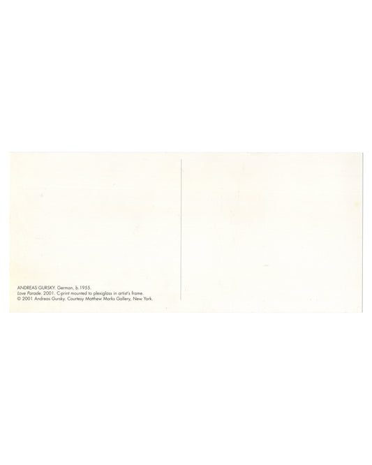 Andreas Gursky, Love Parade, 2001, artist postcard verso. Matthew Marks Gallery, New York, 2001. Cream bifold card, plain to the right panel. Left panel: small sans-serif caption text at lower left: 'ANDREAS GURSKY. German, b. 1955. / Love Parade. 2001. C-print mounted to plexiglass in artist's frame. / © 2001 Andreas Gursky. Courtesy Matthew Marks Gallery, New York.' Light handling marks and minor surface wear.