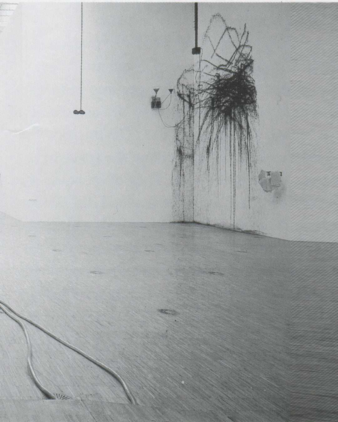 Rebecca Horn, Painting Machine 1988, installation view: motorised ink dispenser suspended in gallery corner, black ink trails dripping down white walls