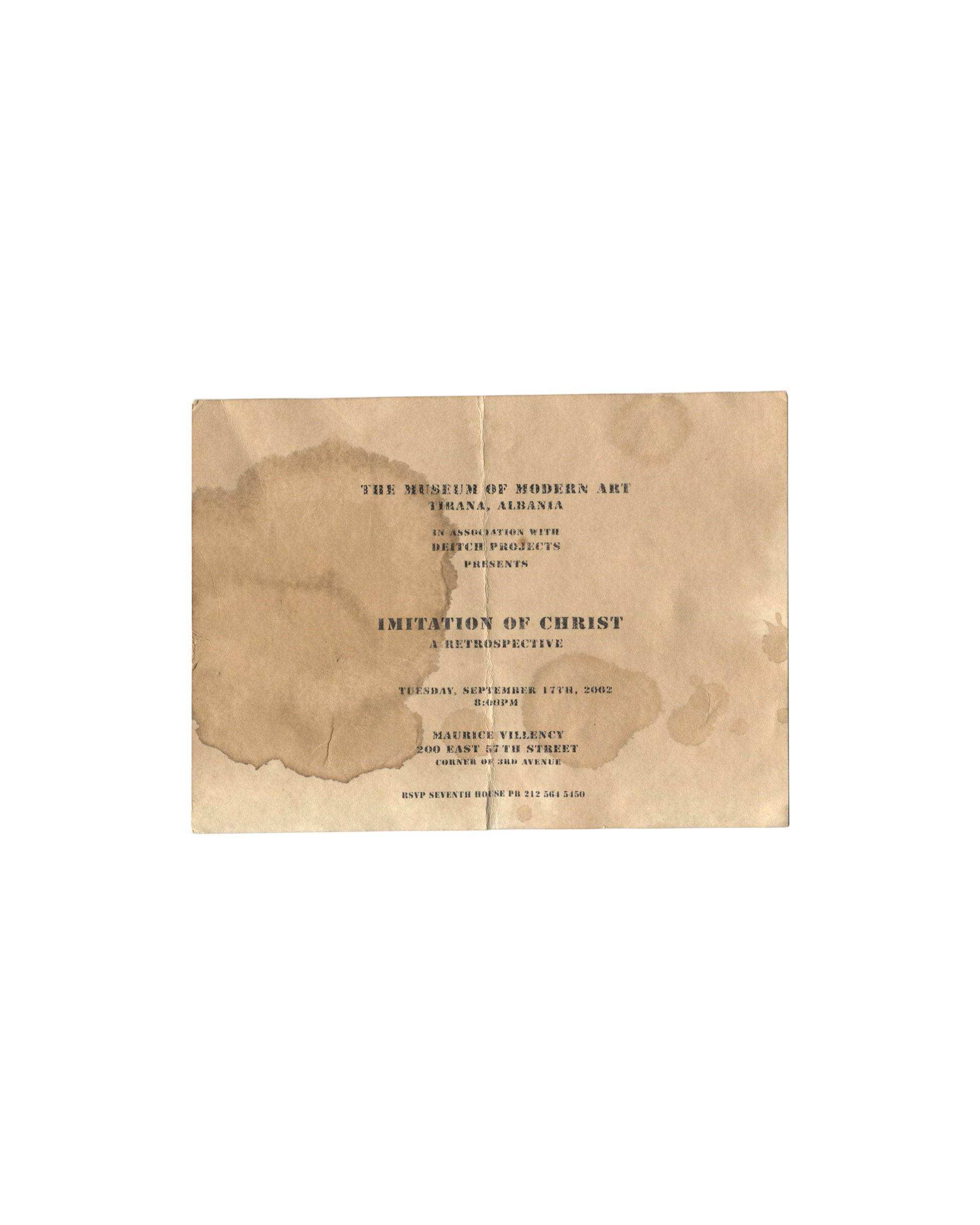 Imitation of Christ: A Retrospective invitation recto, 2002. Cream card with heavy printed faux-water staining; stencil-style typography reading 'The Museum of Modern Art, Tirana, Albania / in association with Deitch Projects / presents / Imitation of Christ: A Retrospective / Tuesday September 17th 2002, 8:00pm / Maurice Villency, 200 East 57th Street, Corner of 3rd Avenue / RSVP Seventh House PR 212 561 5450.