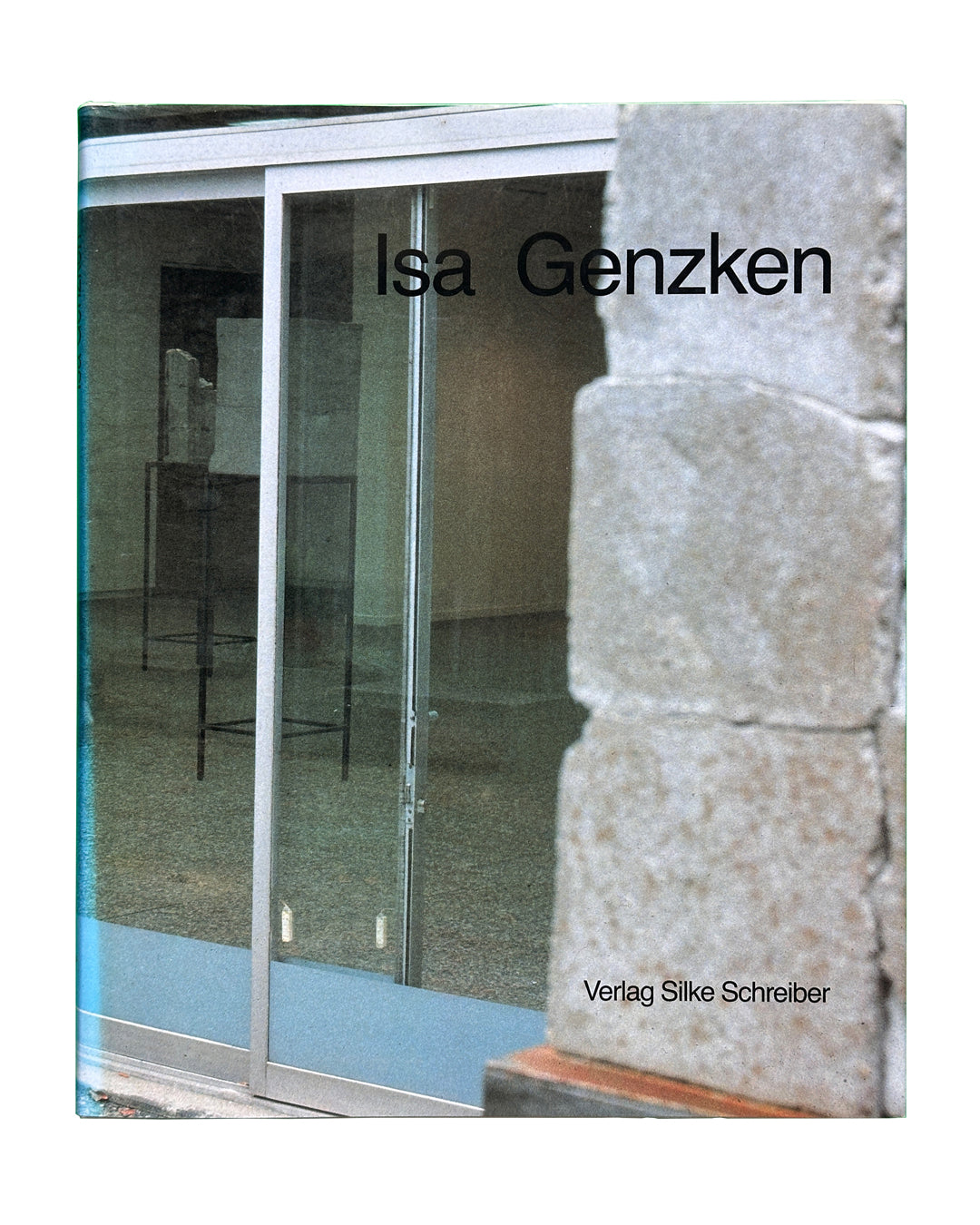 Cover: Isa Genzken — Verlag Silke Schreiber, 1988 — hardback monograph cover, glass door and stone pillar exterior, installation view reflected in glass