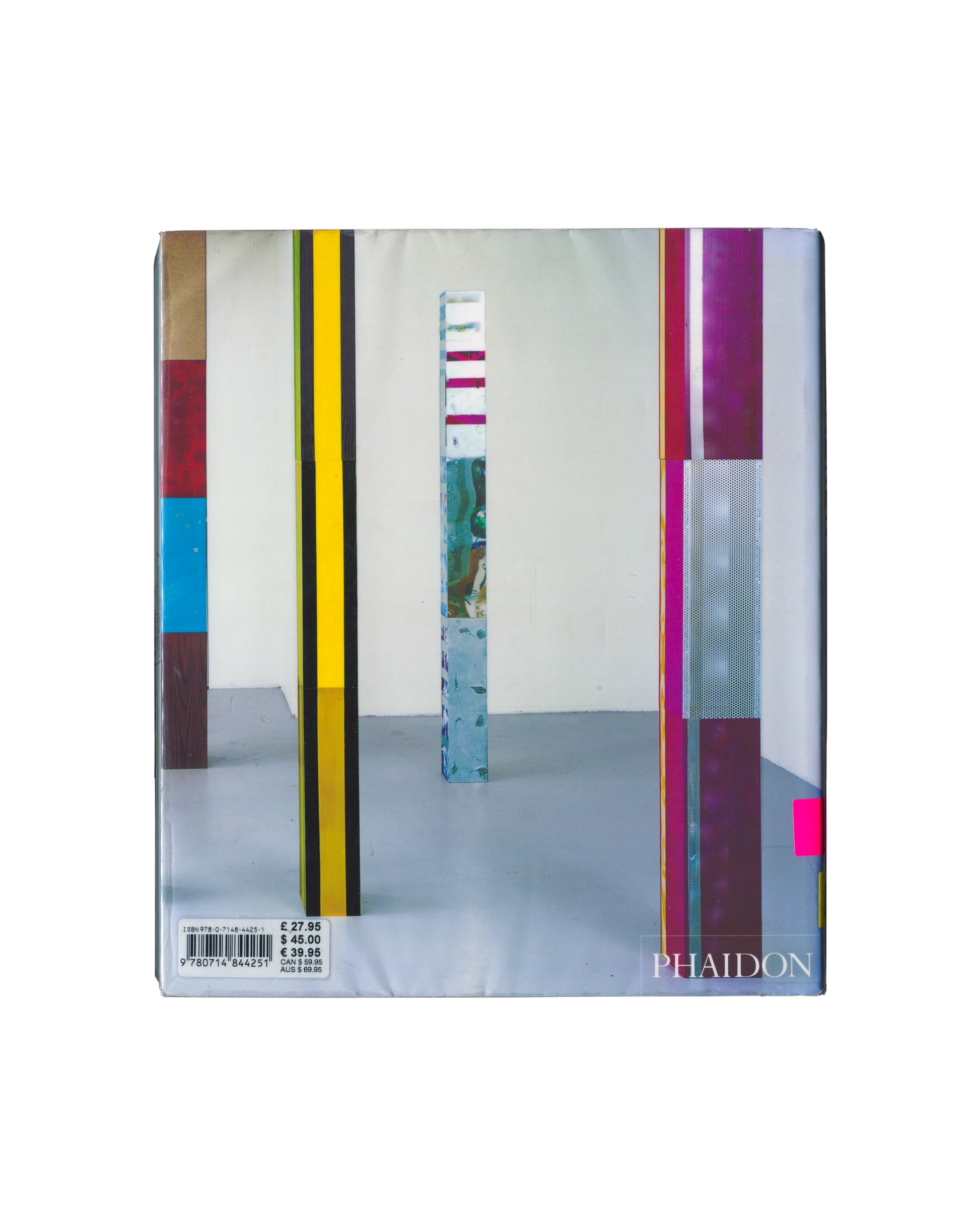 Reverse of 2006 Isa Genzken Phaidon Contemporary Artists Series monograph. Back cover showing a gallery installation view of three tall vertical sculptures: a yellow and black striped column, a mirrored glass column with horizontal coloured bands, and a purple and grey striped column with perforated metal panel. Phaidon imprint lower right. ISBN barcode and price sticker lower left showing £27.95 / $45.00 / €39.95. Laminated ex-library copy.