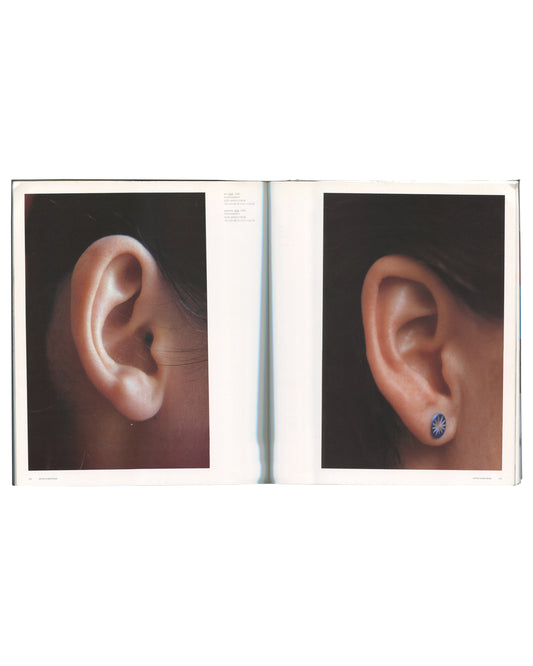 Two full-page close-up photographs of human ears against dark backgrounds, one plain, one with a small circular stud earring.