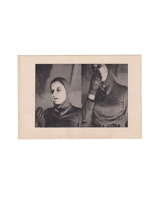 Front of a small 1973 Katharina Sieverding artist card showing a black-and-white double portrait of the artist in a tight hood and gloves, one figure facing down and the other holding a round mirror over the face, printed within a wide cream border.