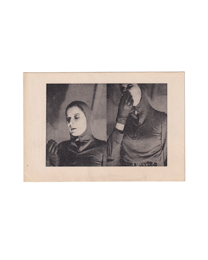 Front of a small 1973 Katharina Sieverding artist card showing a black-and-white double portrait of the artist in a tight hood and gloves, one figure facing down and the other holding a round mirror over the face, printed within a wide cream border.
