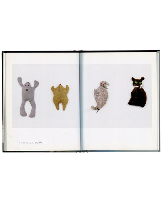 Mike Kelley, Two Frogs and Two Cats, 1990, interior spread, four stuffed animal works against white ground