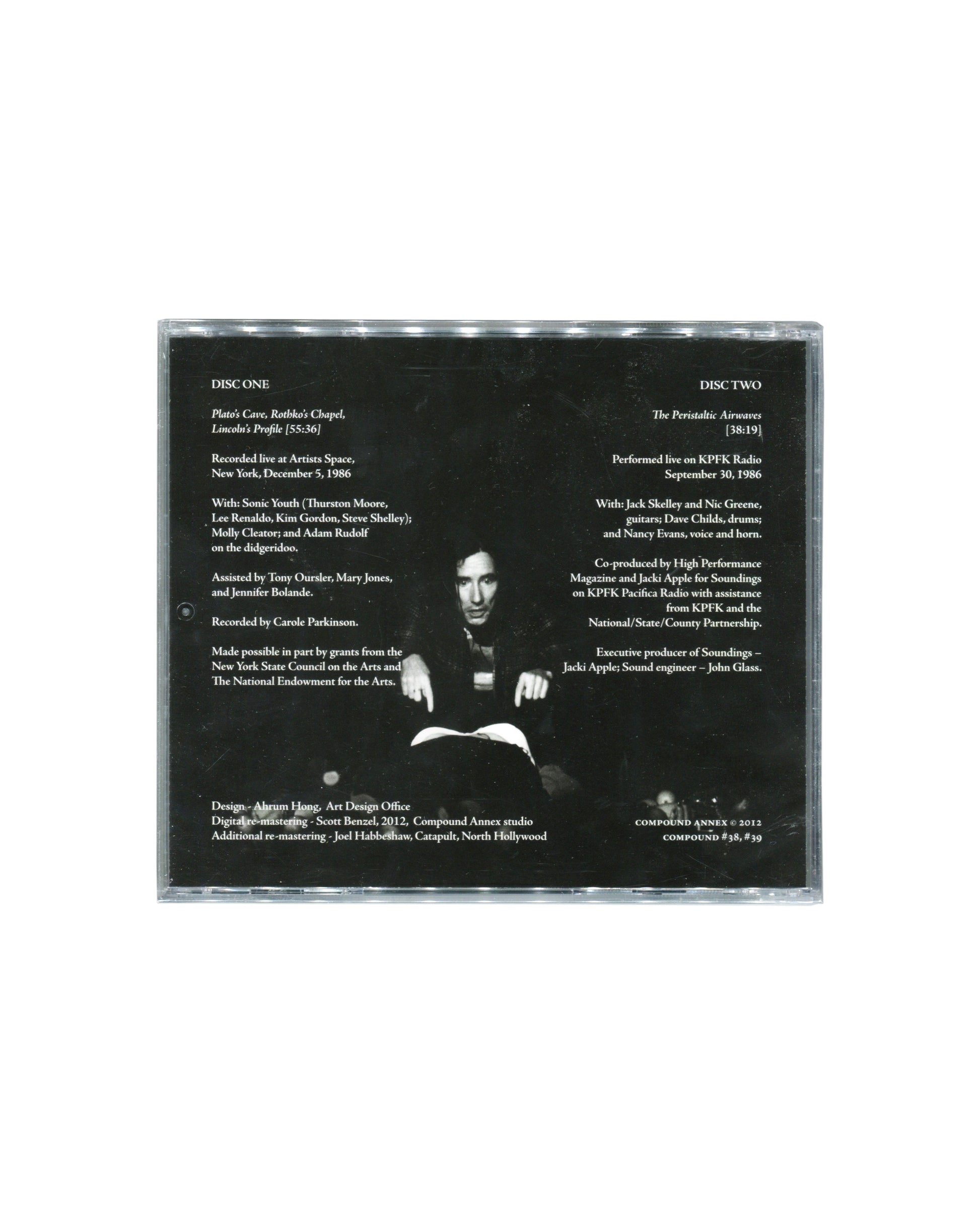 Reverse of sealed Mike Kelley double CD showing track information, recording credits, performance details, and a black-and-white photograph of Kelley. Includes references to Sonic Youth, Artists Space, New York, and KPFK Radio, Los Angeles.