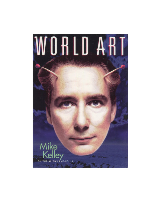 Front Original c. 2000–2001 Mike Kelley World Art magazine GoCard promotional postcard, front, showing the magazine cover with a digitally composited colour image of a man's face with stylised pink antennae rising from his temples against a dramatic purple and blue clouded sky, with the masthead WORLD ART in large white outlined capitals at top and the text Mike Kelley / ON THE ALIENS AMONG US in white and pale green type at lower left.