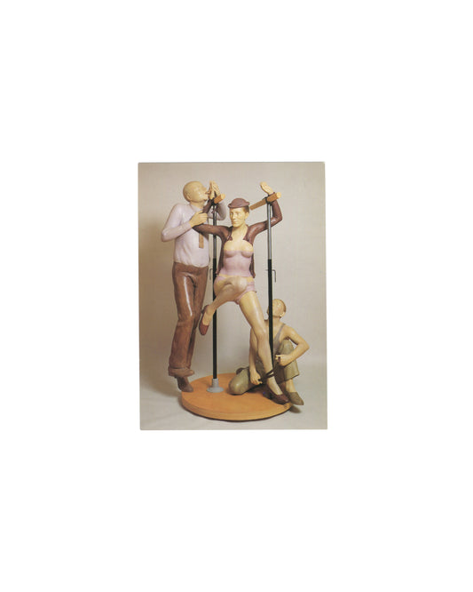 1999 Pierre Klossowski exhibition invitation featuring a color reproduction of *Roberte aux barres parallèles* (1990). Three stylized human figures are arranged around parallel bars on a circular base: a central female figure in pink clothing raises one leg while two surrounding figures engage with the structure. The sculpture is rendered in painted flesh, mauve, and brown tones against a neutral background, with “Pierre Klossowski” printed beneath.