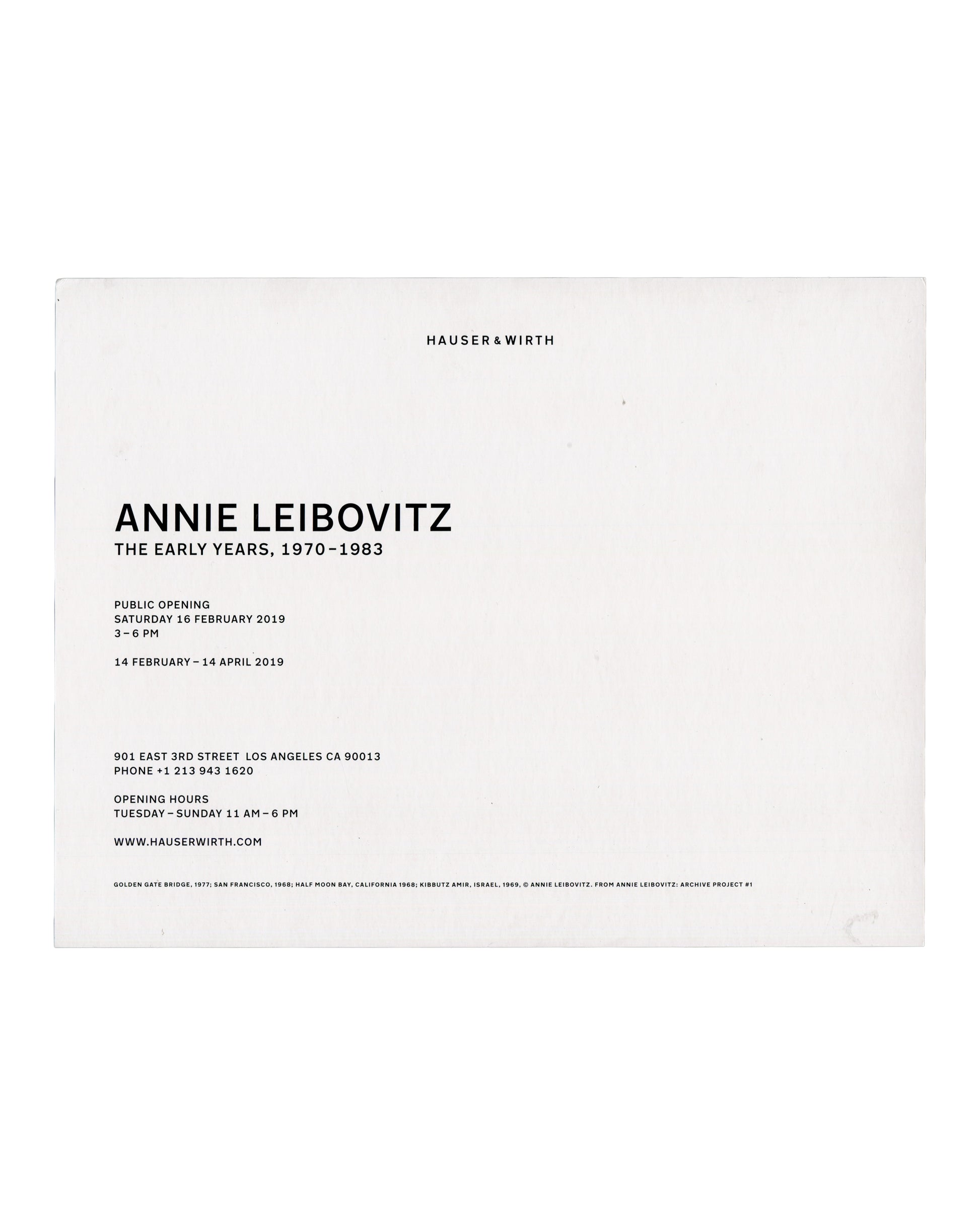 Recto Annie Leibovitz, The Early Years, 1970–1983: Archive Project No. 1, Hauser & Wirth Los Angeles, 2019. Invitation recto: white card; four black and white photographs in a 2×2 grid — top left, view from inside a car approaching the Golden Gate Bridge in fog, 1977; top right, coastal landscape seen through a car window, Half Moon Bay, California, 1968; bottom left, close self-portrait of a woman from the shoulders up, San Francisco, 1968; bottom right, two wooden ladders standing among trees and shrubs, 