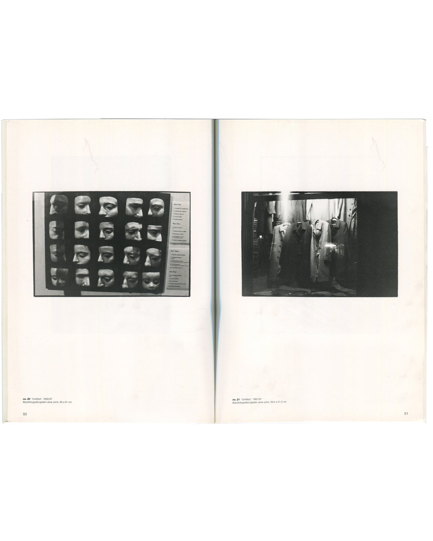 Interior spread of Zoe Leonard, Secession, Wiener Secession, 1997, pages 50–51, left page showing a black-and-white photograph of a grid of plaster face masks mounted on a display board with typed labels captioned "Untitled, 1990–97," right page showing a black-and-white photograph of a dimly lit interior with hanging garments and industrial equipment captioned "Untitled, 1993–97.