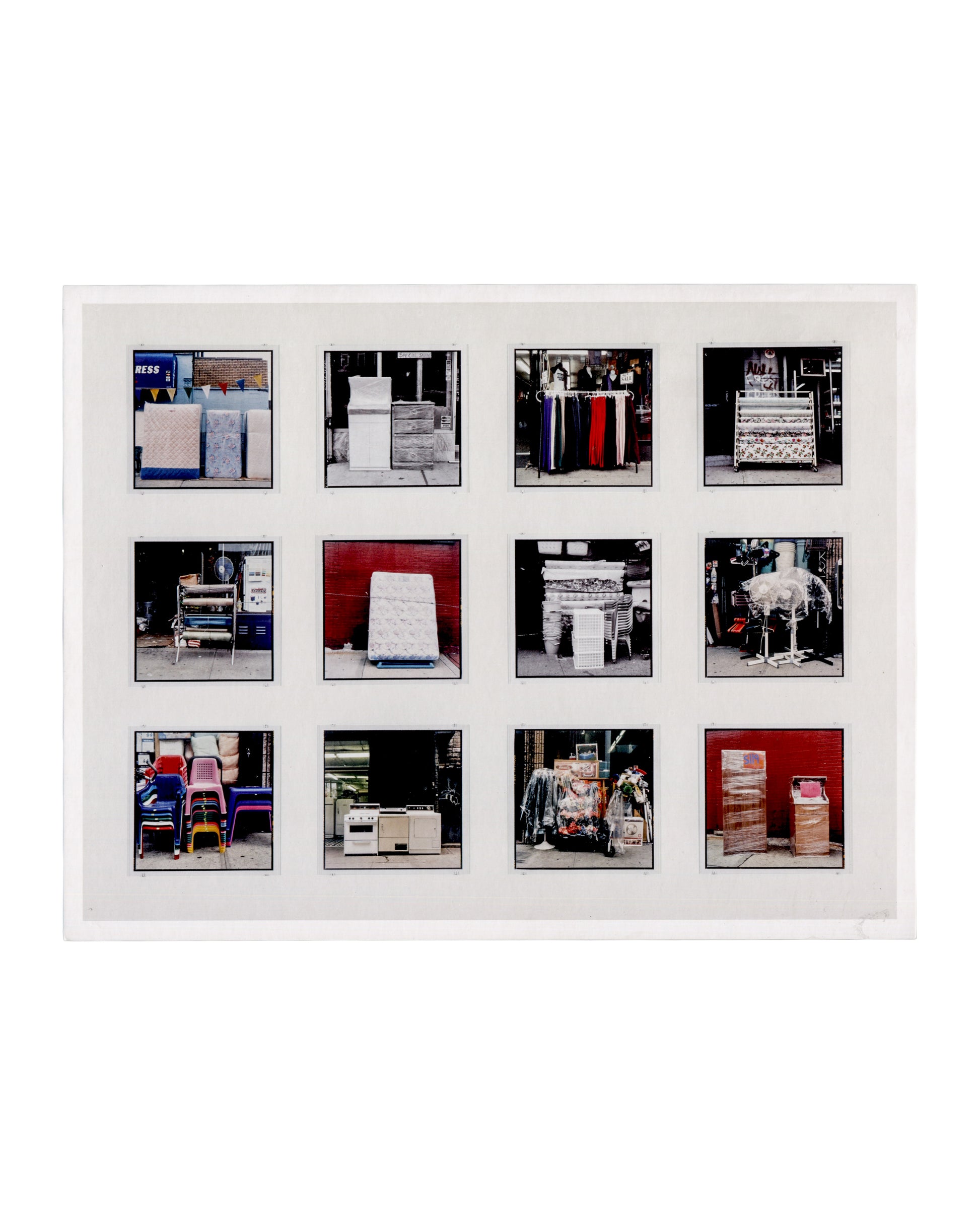  Recto Zoe Leonard, Analogue, Hauser & Wirth Los Angeles, 2018. Invitation recto: white card; twelve colour and monochrome square photographs in a 4×3 grid with black film borders — street-level goods between use and resale: mattresses, garments on racks, stacked chairs, appliances, a mannequin, wrapped merchandise and cardboard boxes, all photographed on pavements or in storefronts.