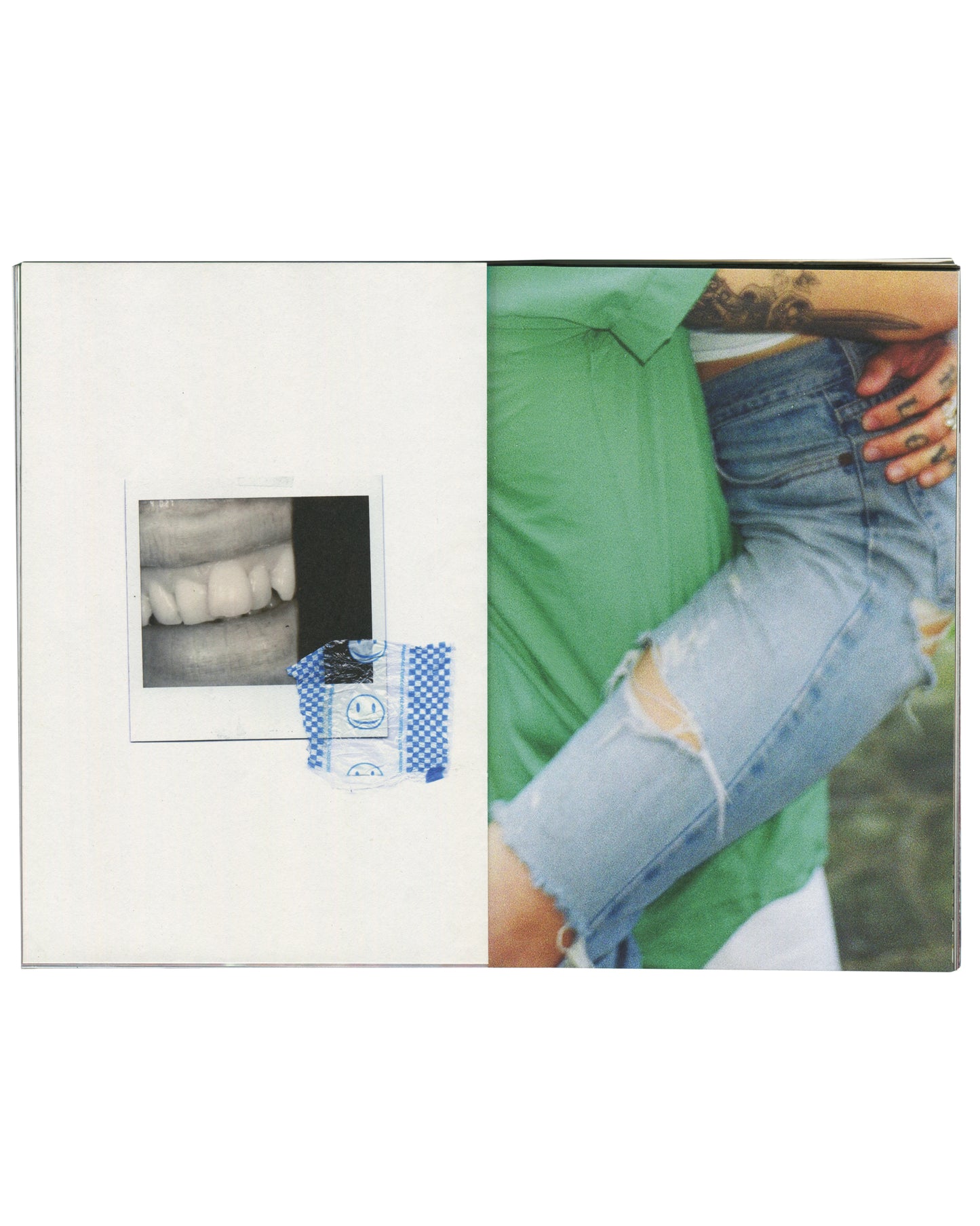  interior spread — left: white page with small Polaroid photograph of teeth/mouth close-up, taped with blue smiley-face washi tape; right: colour photograph, tattooed hand gripping waistband of distressed denim jeans, green shirt