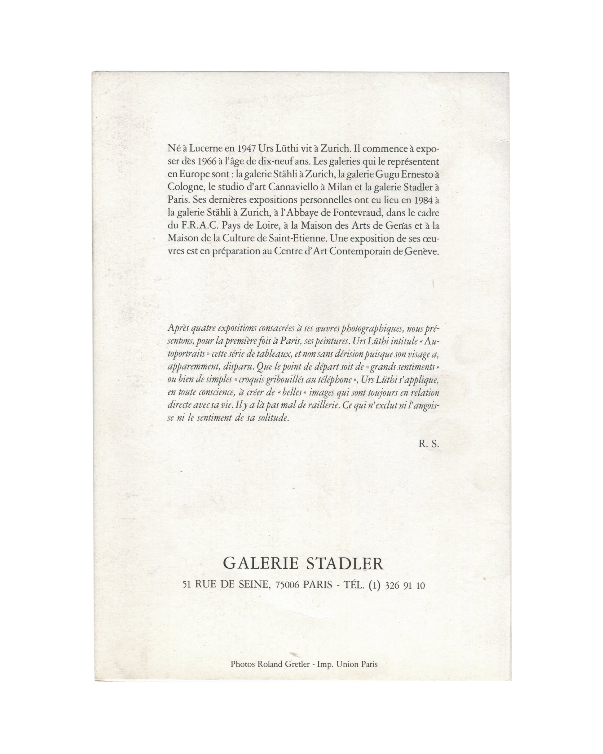 Reverse of 1985 Urs Lüthi Autoportraits invitation, Galerie Stadler, Paris, showing a biographical note and critical text by R. S. in roman and italic serif type, with gallery address 51 Rue de Seine, 75006 Paris at the foot, and photo credit Roland Gretler / Imp. Union Paris.