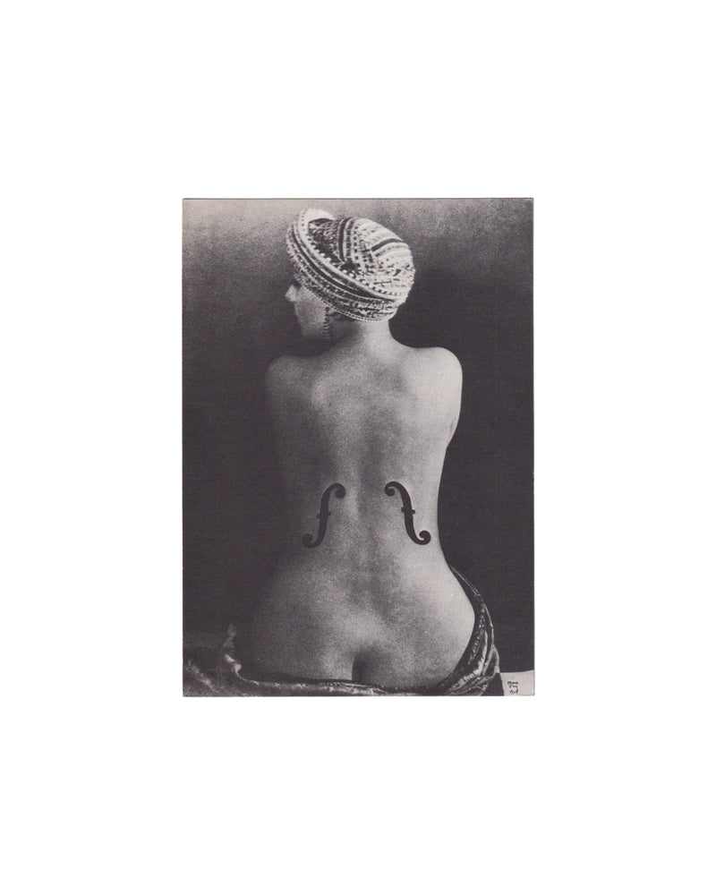Recto (front):

Man Ray, Kunsthalle Basel, 1980. Recto: black-and-white reproduction of Violon d'Ingres (1924) — female nude seen from behind, wearing a turban, with f-holes drawn onto the lower back. Man Ray monogram visible at lower right.