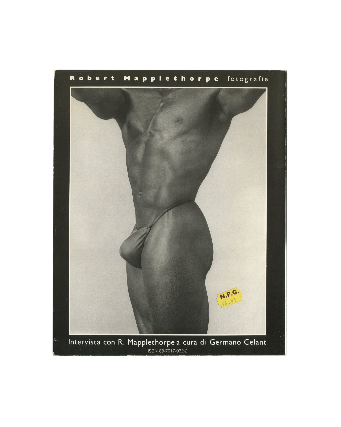 Robert Mapplethorpe — Fotografie, Idea Books Edizioni, Milan, 1983. Front cover. Black ground, title in spaced white capitals: 'Robert Mapplethorpe fotografie'. Centre: black-and-white photograph of a male torso in a white swimsuit, cropped at shoulders and thighs, high-contrast studio lighting. Lower text: 'Intervista con R. Mapplethorpe a cura di Germano Celant'. ISBN 88-7017-032-2. Original yellow N.P.G. price sticker lower right: 19.95. Photography monograph, Italian edition.