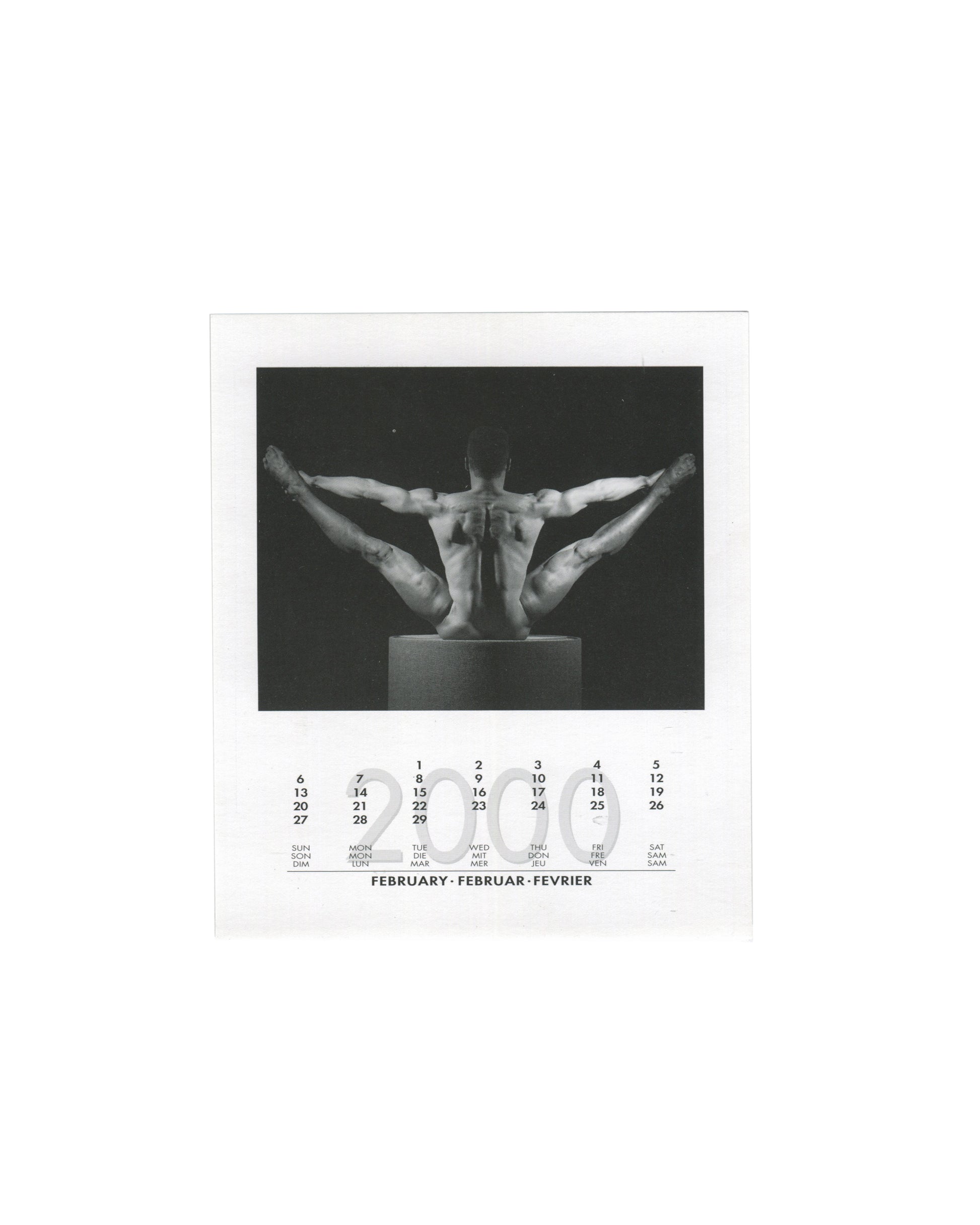  February 2000 card from Robert Mapplethorpe, 2000 Calendar, teNeues, 1999, showing a black-and-white photograph of two nude male figures seated back-to-back on a plinth, their legs extended symmetrically outward and upward to form a wide V-shape against a dark background, with the February 2000 calendar grid printed below in English, German, and French.