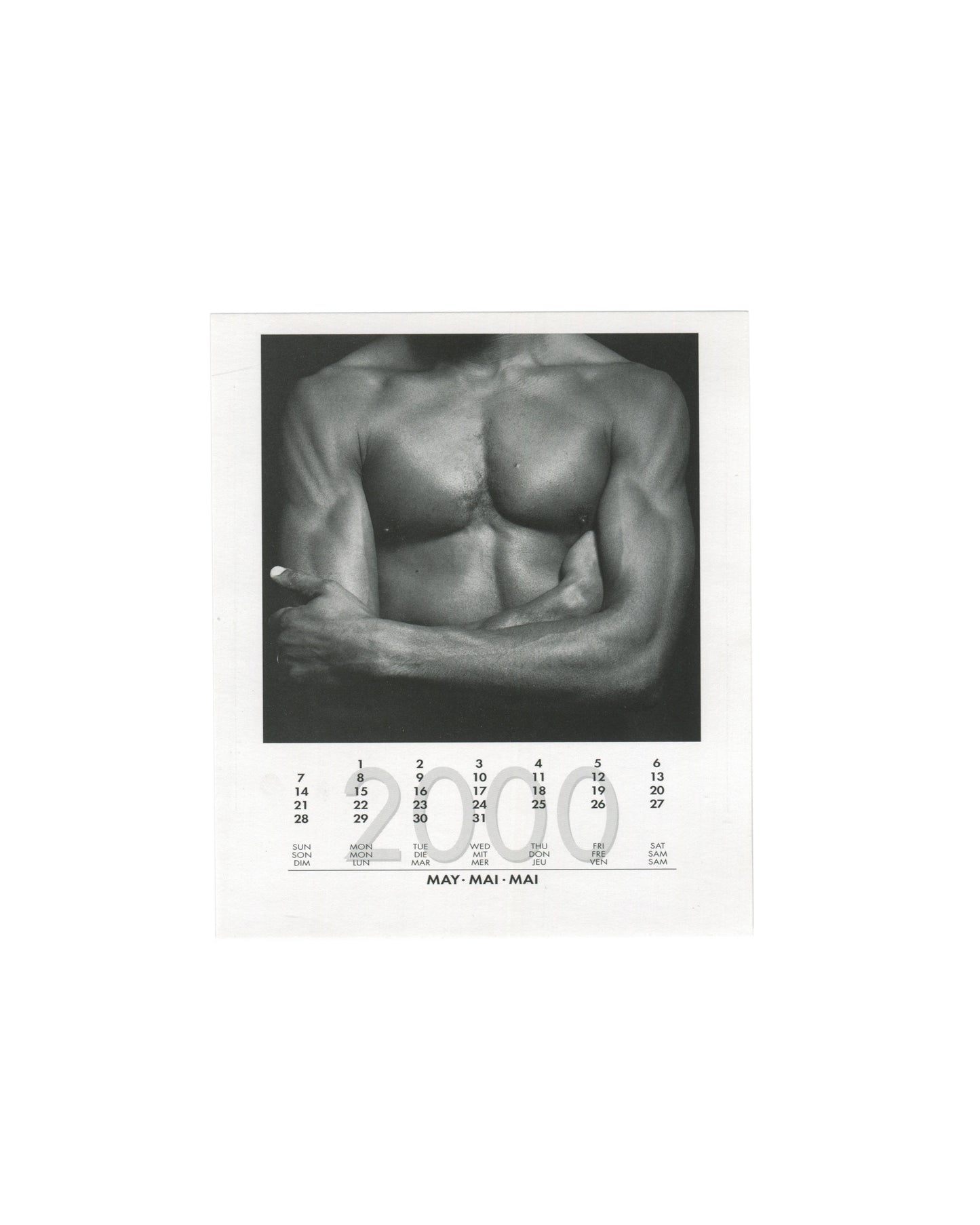 May 2000 card from Robert Mapplethorpe, 2000 Calendar, teNeues, 1999, showing a black-and-white close-up photograph of a male torso from the front, the chest, abdomen, and crossed arms filling the frame, lit to emphasise musculature against a dark background, with the May 2000 calendar grid printed below in English, German, and French.
