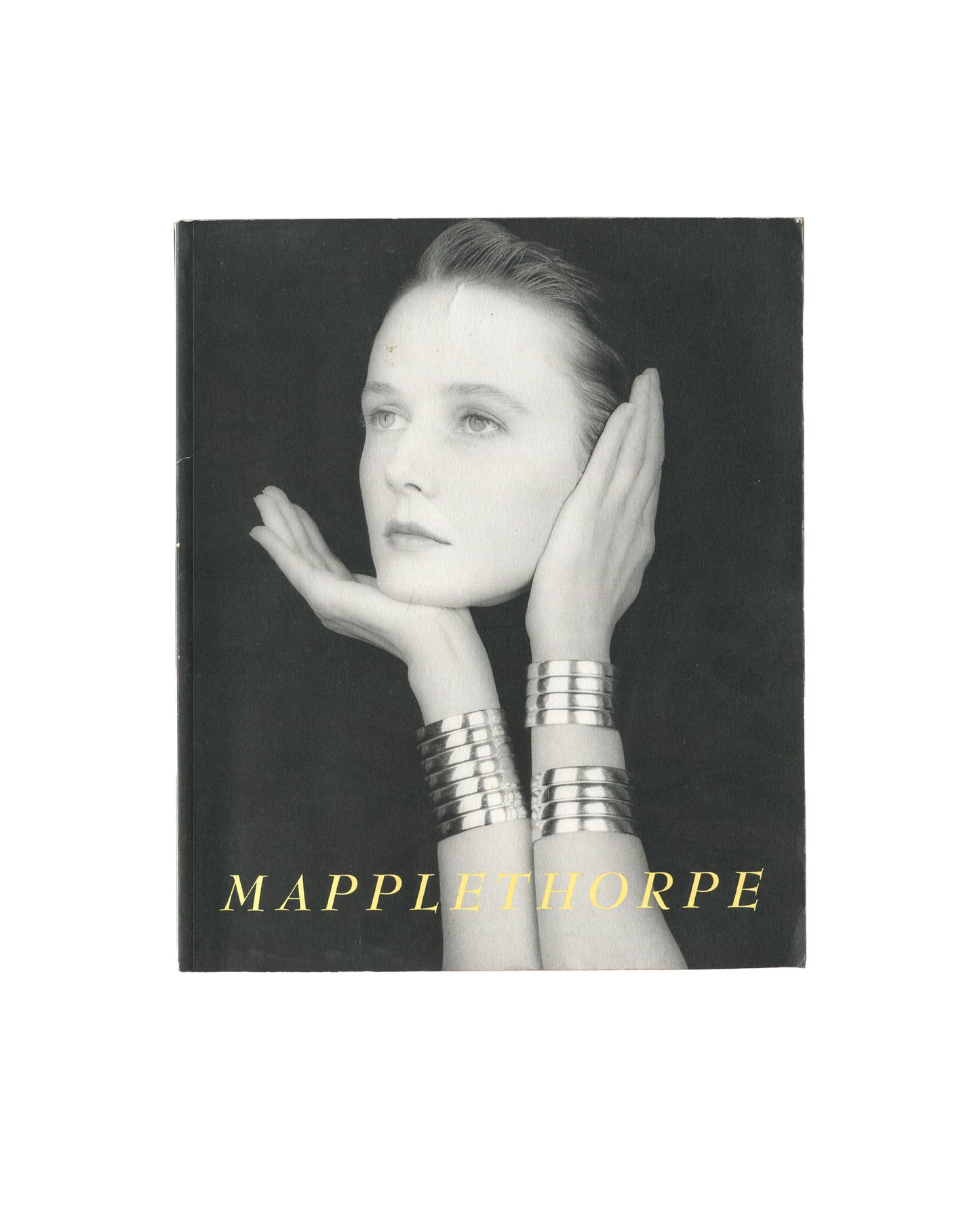 Cover of Robert Mapplethorpe, Some Women, Bulfinch Press, Boston, 1992, showing a black-and-white close-up photograph of a woman's face cropped from the forehead to the chin, eyes gazing directly at the camera, against a dark background, with the title SOME WOMEN in white serif capitals at lower left and ROBERT MAPPLETHORPE in smaller white serif capitals above.