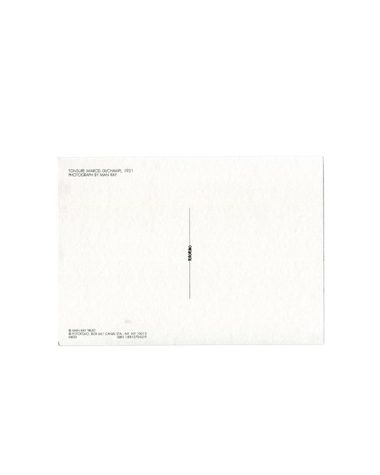 Postcard verso, Man Ray, Tonsure (Marcel Duchamp), 1921, published by Fotofolio, New York, n.d. [c.1984]. White ground, divided postal back with vertical rule and small registration mark at centre. Upper left: small black sans-serif — 'TONSURE (MARCEL DUCHAMP), 1921 / PHOTOGRAPH BY MAN RAY'. Lower left: '© MAN RAY TRUST / © FOTOFOLIO, BOX 661 CANAL STA., NY, NY 10013 / ISBN 1-881270-62-9 / MR30'. Light age toning, small marks, good vintage condition.

