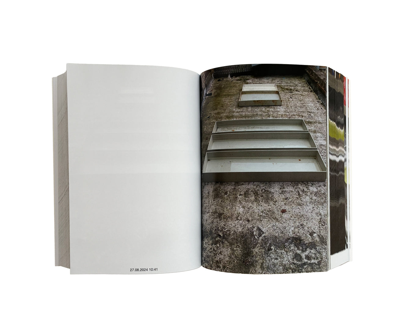 Matthew Peers – Wishing Wells, open spread showing blank left page with timestamp "27.08.2024 10:41" and full-bleed photograph of metal trays on weathered concrete ground, right page