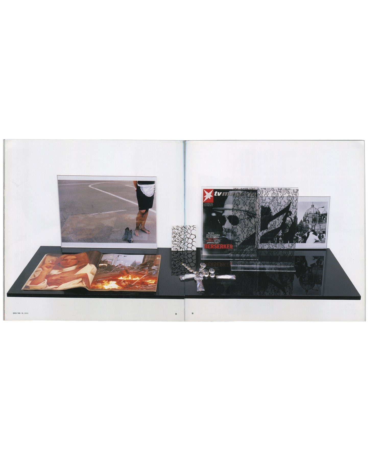 Josephine Meckseper, Catalogue No. 1, Lukas & Sternberg 2004, vitrine with magazines, devotional objects and luxury surfaces