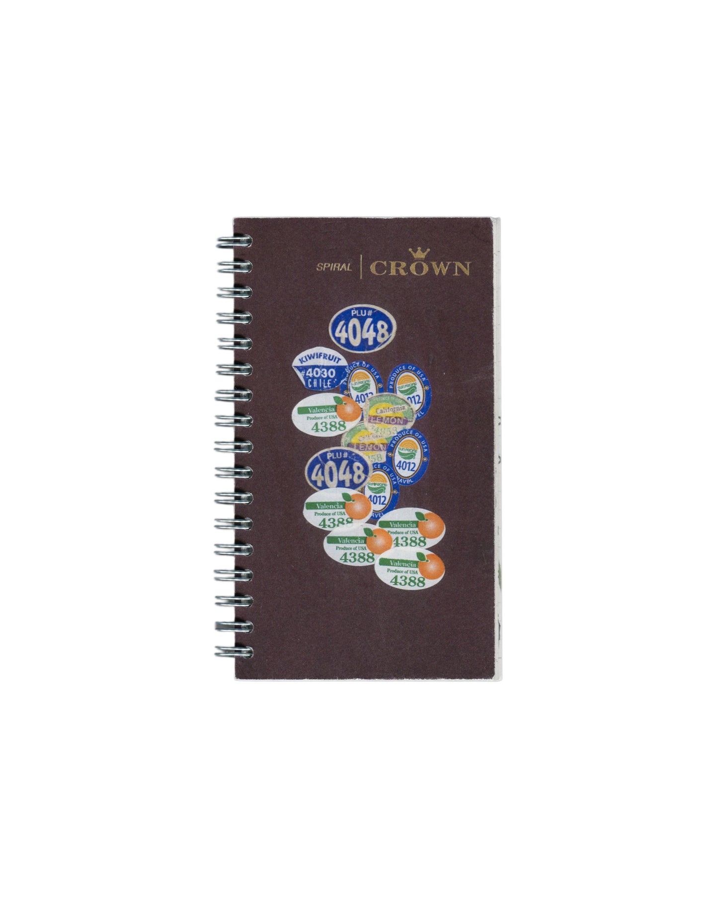 Facsimile artist sketchbook, Rafael Melendez, Peel You: A 2006 Facsimile Sketchbook, The Academy of Realness, 2021. Edition of 2. 8 × 15.5 cm, 102 pages, spiral-bound. Dark brown Crown Spiral notebook cover reproduced with produce stickers applied: PLU# 4048 (×2), Kiwifruit 4030 Chile, Valencia 4388 (×4), Lemon 4012 (×2), and further overlapping fruit PLU labels in blue, green, and orange. Silver spiral binding left edge.