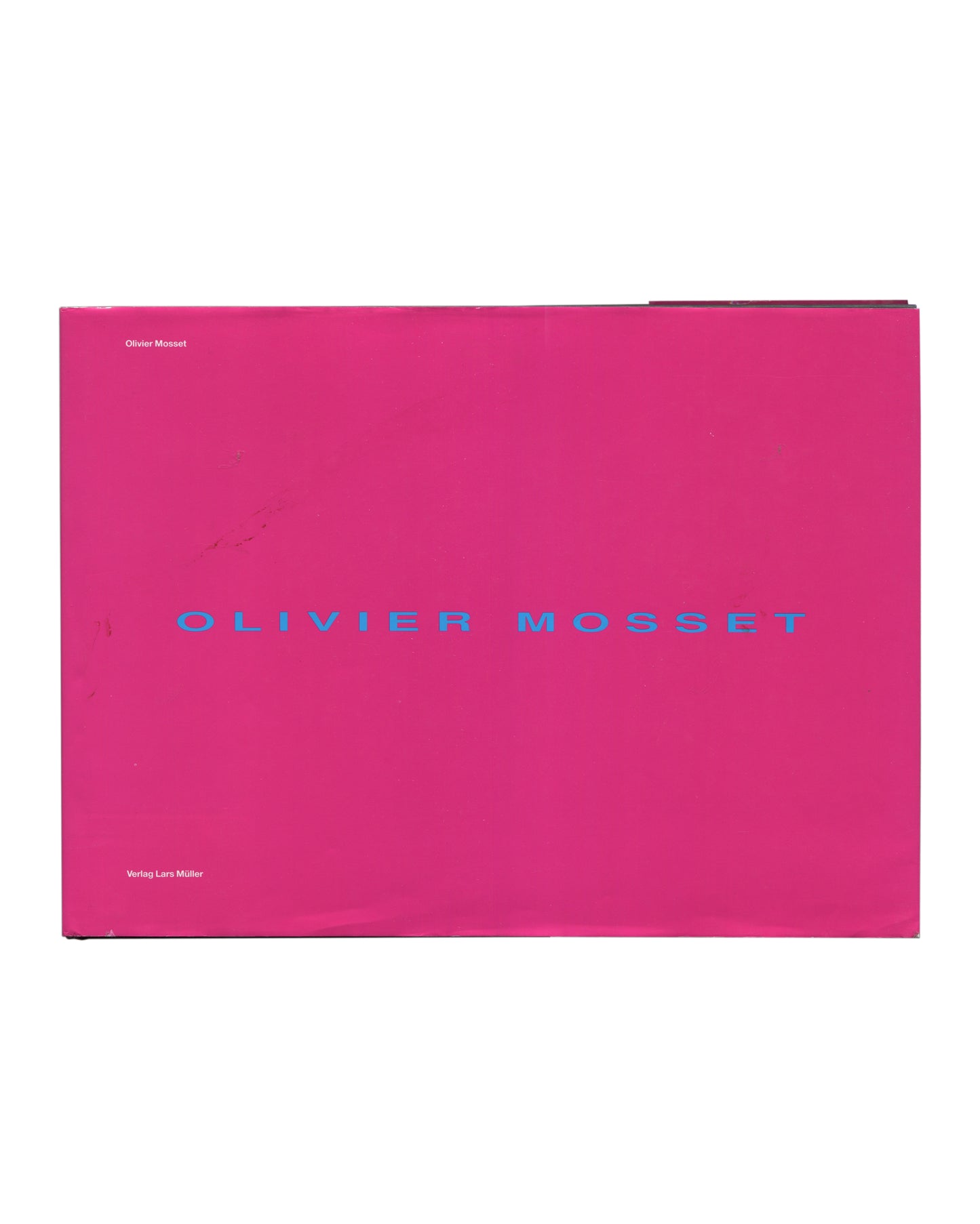 Dust jacket front cover, Olivier Mosset, Verlag Lars Müller, Baden, 1990. Hot-pink laminated jacket, landscape format, approx. 30.5 × 22.4 cm. 'Olivier Mosset' upper left; 'OLIVIER MOSSET' spaced cyan sans-serif centre; 'Verlag Lars Müller' lower left. Light rubbing and minor corner wear, very good condition.