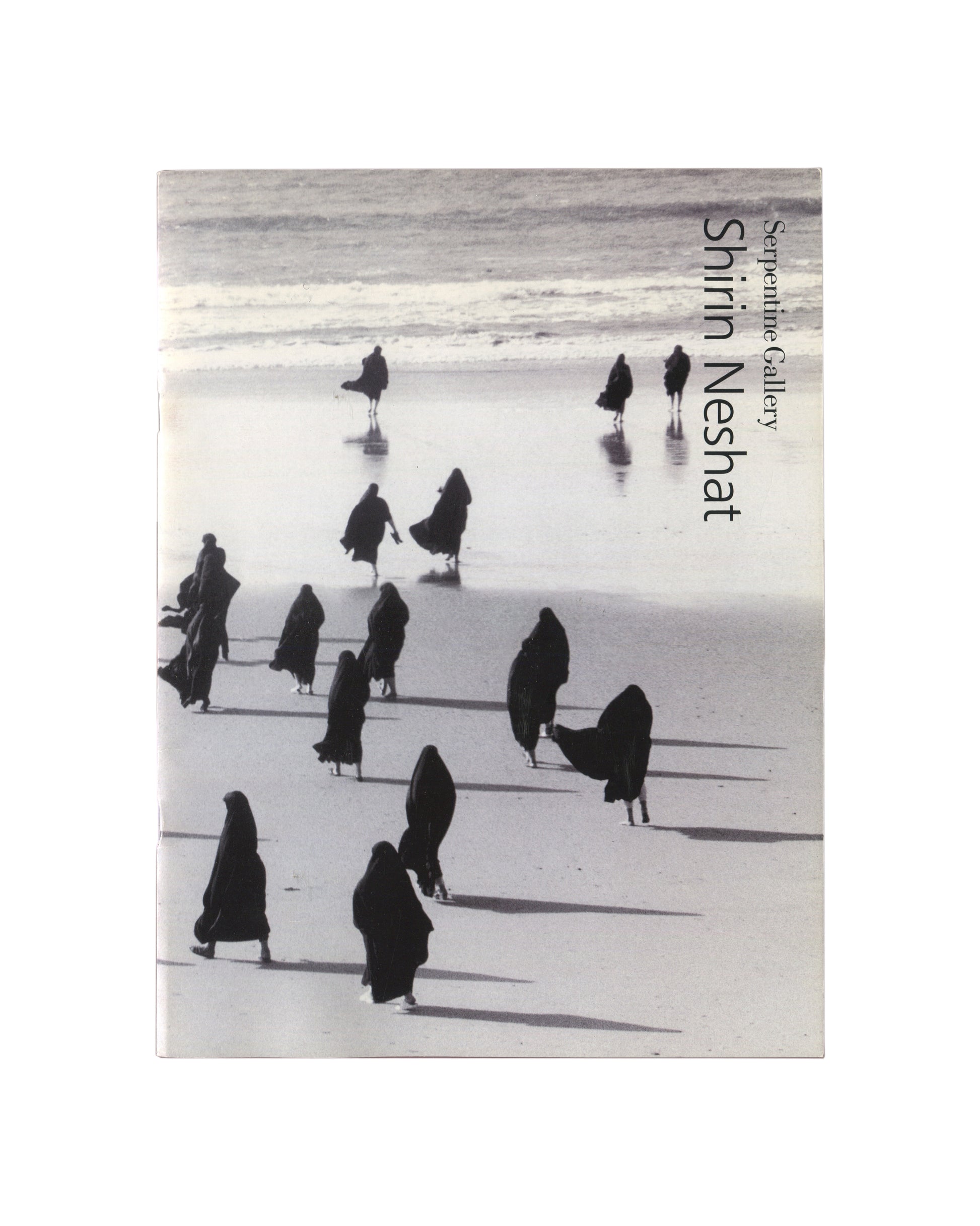 Shirin Neshat, Rapture, 1999, dual-panel still: men seated in white at left, women in black chadors at right 
