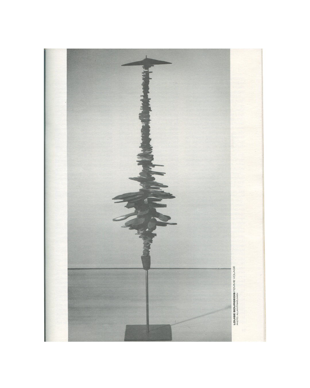 `New Observations No. 50, September 1987 — interior plate. Louise Bourgeois, Femme Volage (Fickle Woman), 1951. Black and white photograph of a tall, slender bronze sculpture composed of stacked irregular horizontal elements on a thin vertical pole and square base, photographed against a neutral gallery ground.`