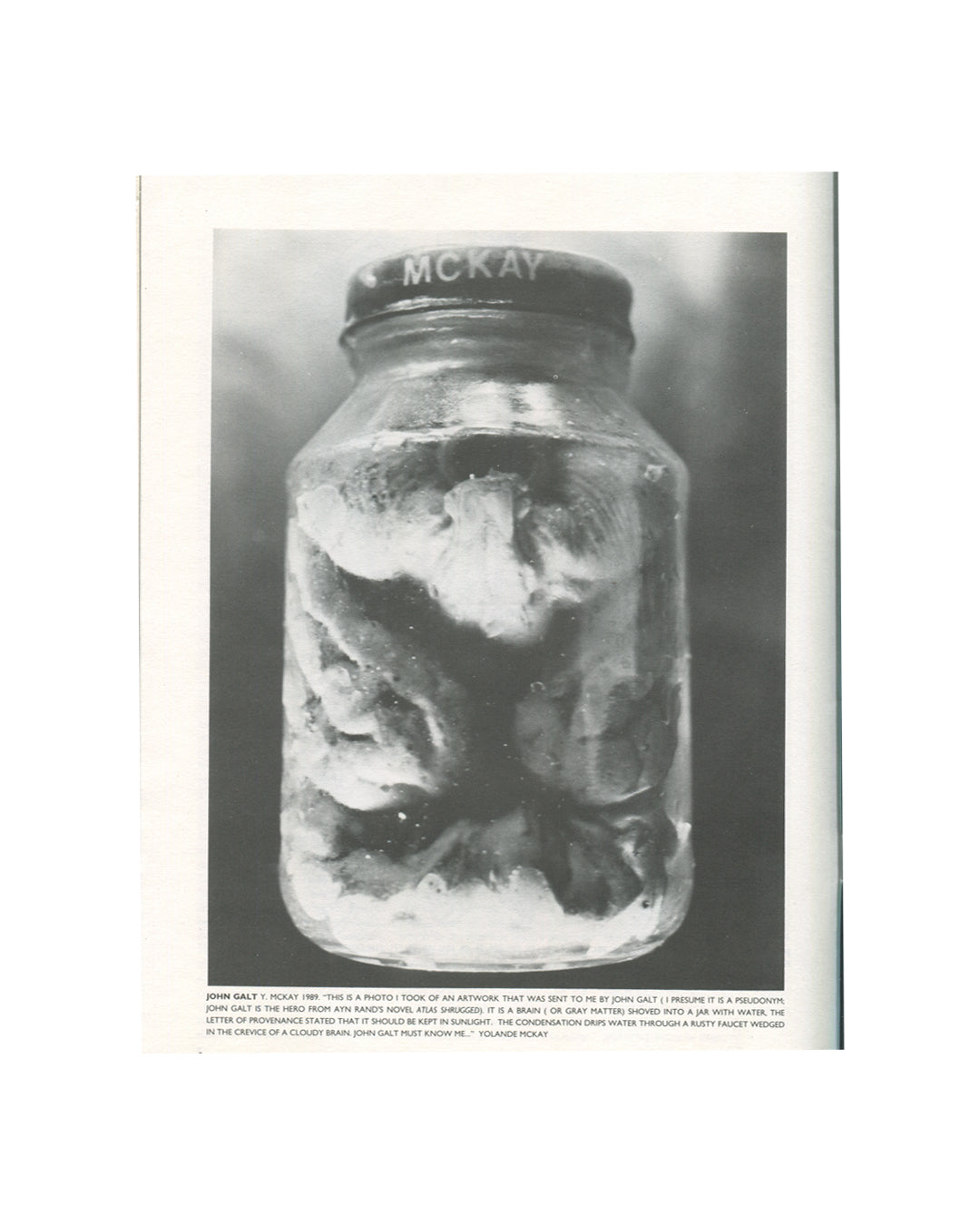 New Observations No. 51, 1987 — interior plate. Black and white photograph of a glass jar labelled McKay containing grey matter submerged in water. John Galt, Y. McKay, 1986. Text by Yolande McKay describing the work as a brain sent by John Galt, a pseudonym.