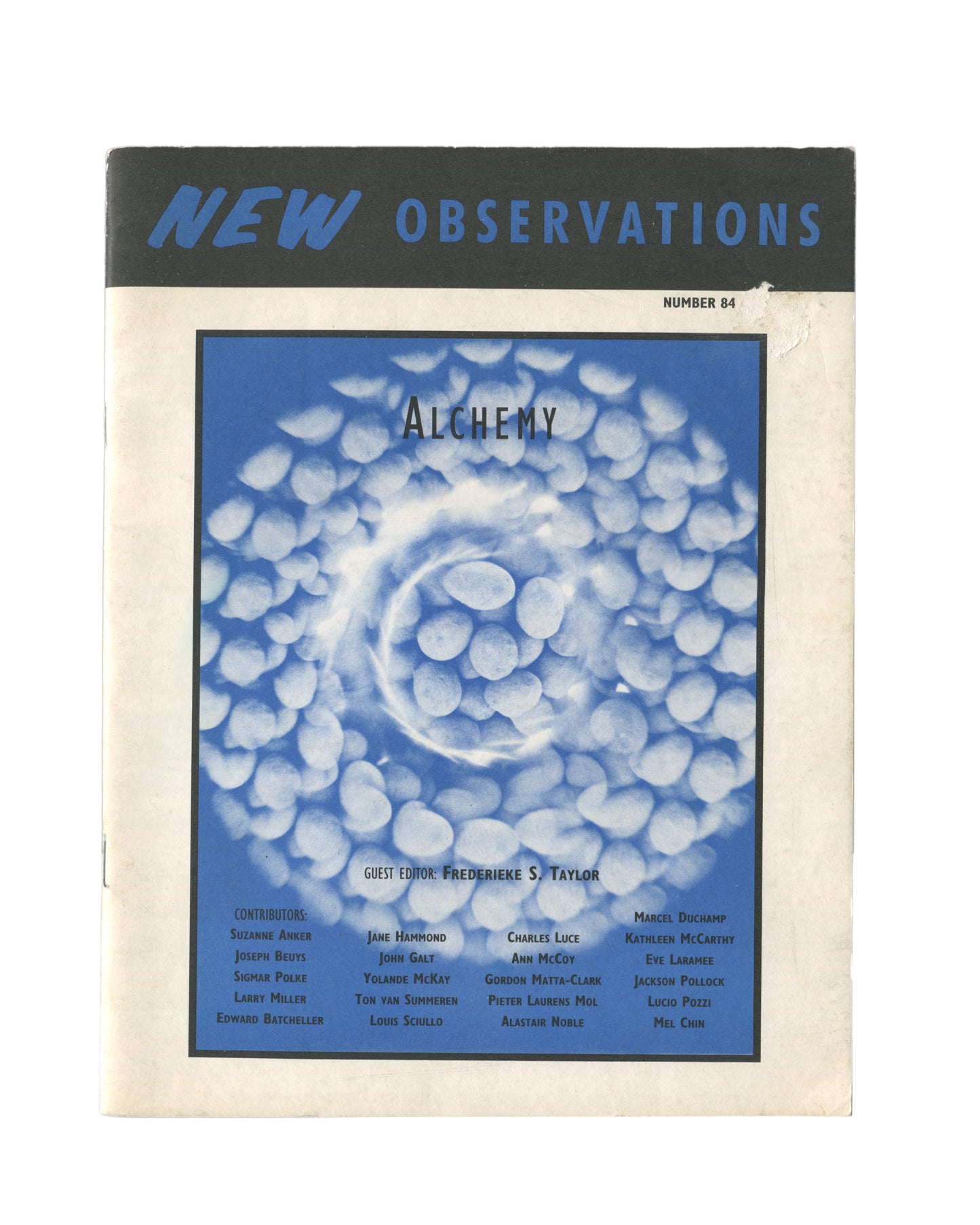 New Observations No. 84 — front cover. Alchemy, guest editor Frederieke S. Taylor. Blue photographic image of white pebbles arranged in a spiral formation. Contributors include Joseph Beuys, Sigmar Polke, Gordon Matta-Clark, Jackson Pollock, Lucio Pozzi.
