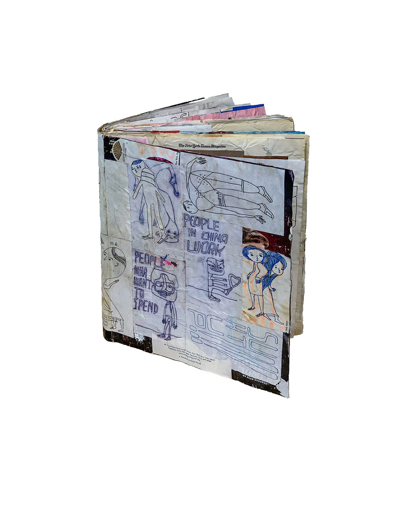 Exterior view showing heavily worked covers and spine; blue tape, polka-dot paper patches, and layered collage elements visible across front and back boards; accumulated material thickness visible at spine edge; object shows significant handling consistent with production and use
