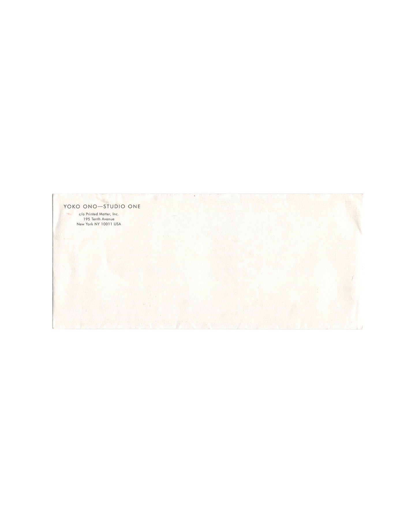 Front of original Yoko Ono Studio One envelope distributed with the *Dollar Piece* Printed Matter membership multiple, showing return address information and light handling wear.