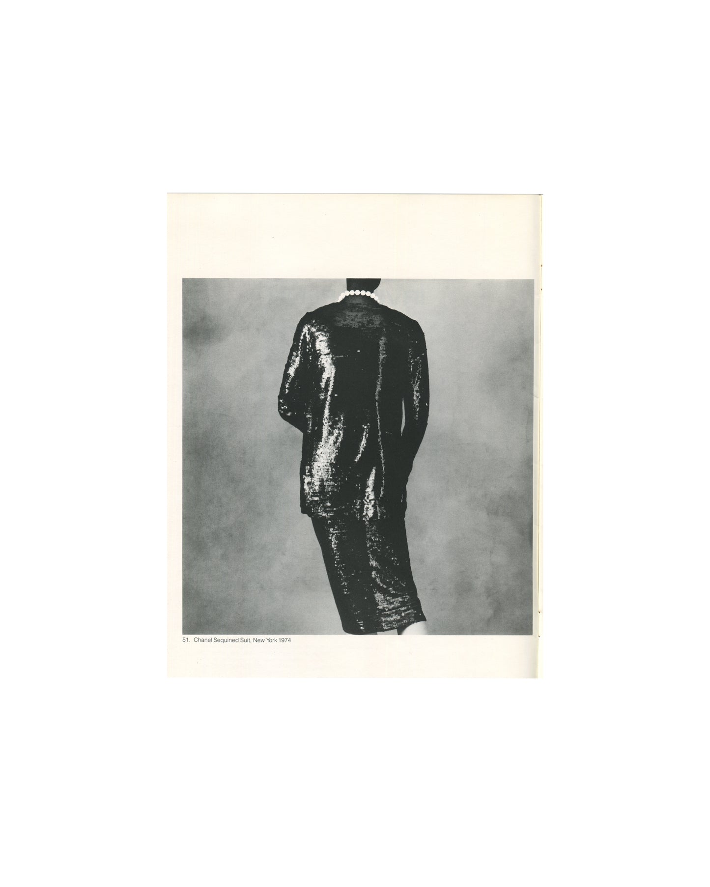 Irving Penn, Chanel Sequined Suit, New York 1974, figure from rear in sequined dress, pearl necklace 