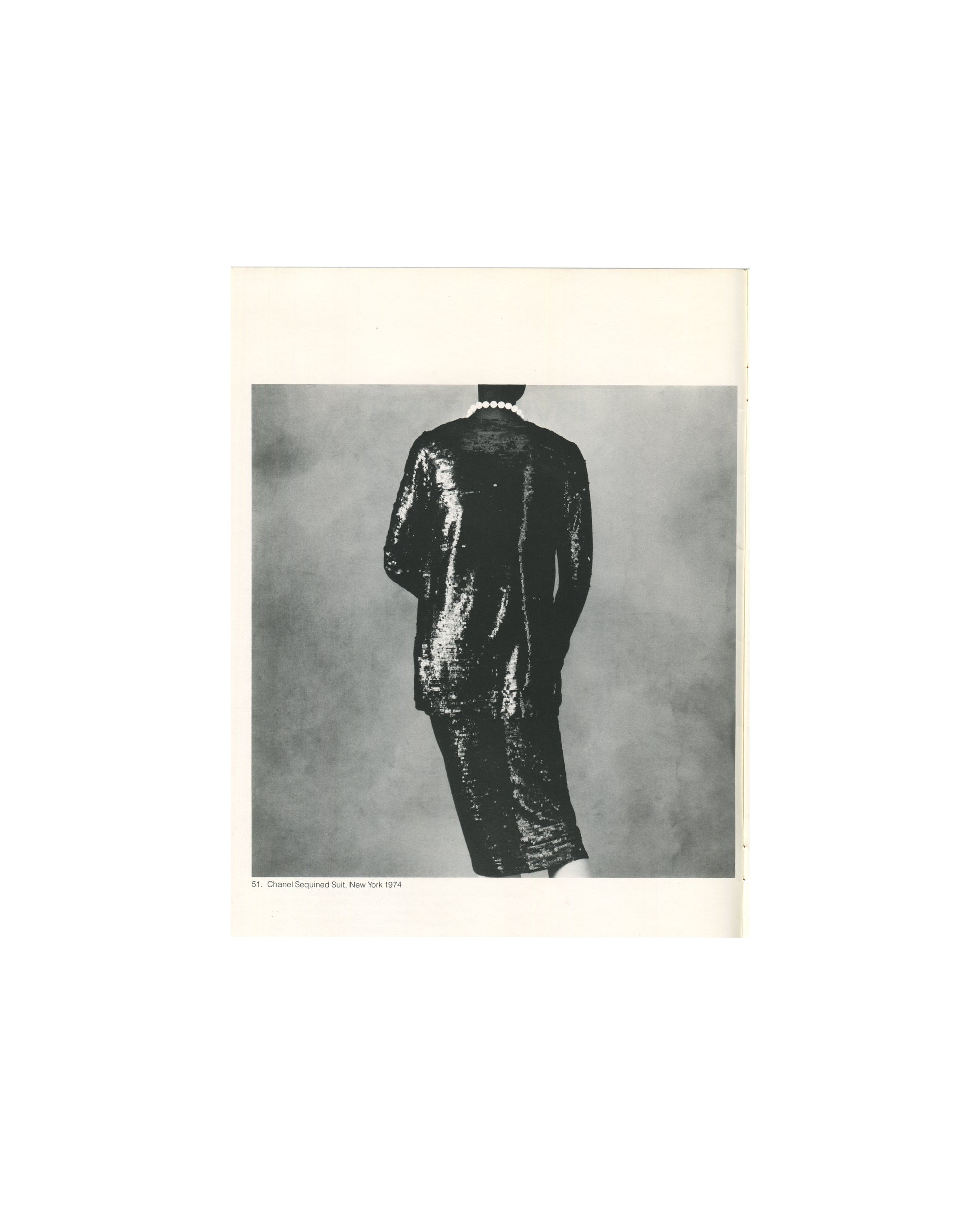 Irving Penn, Chanel Sequined Suit, New York 1974, figure from rear in sequined dress, pearl necklace 