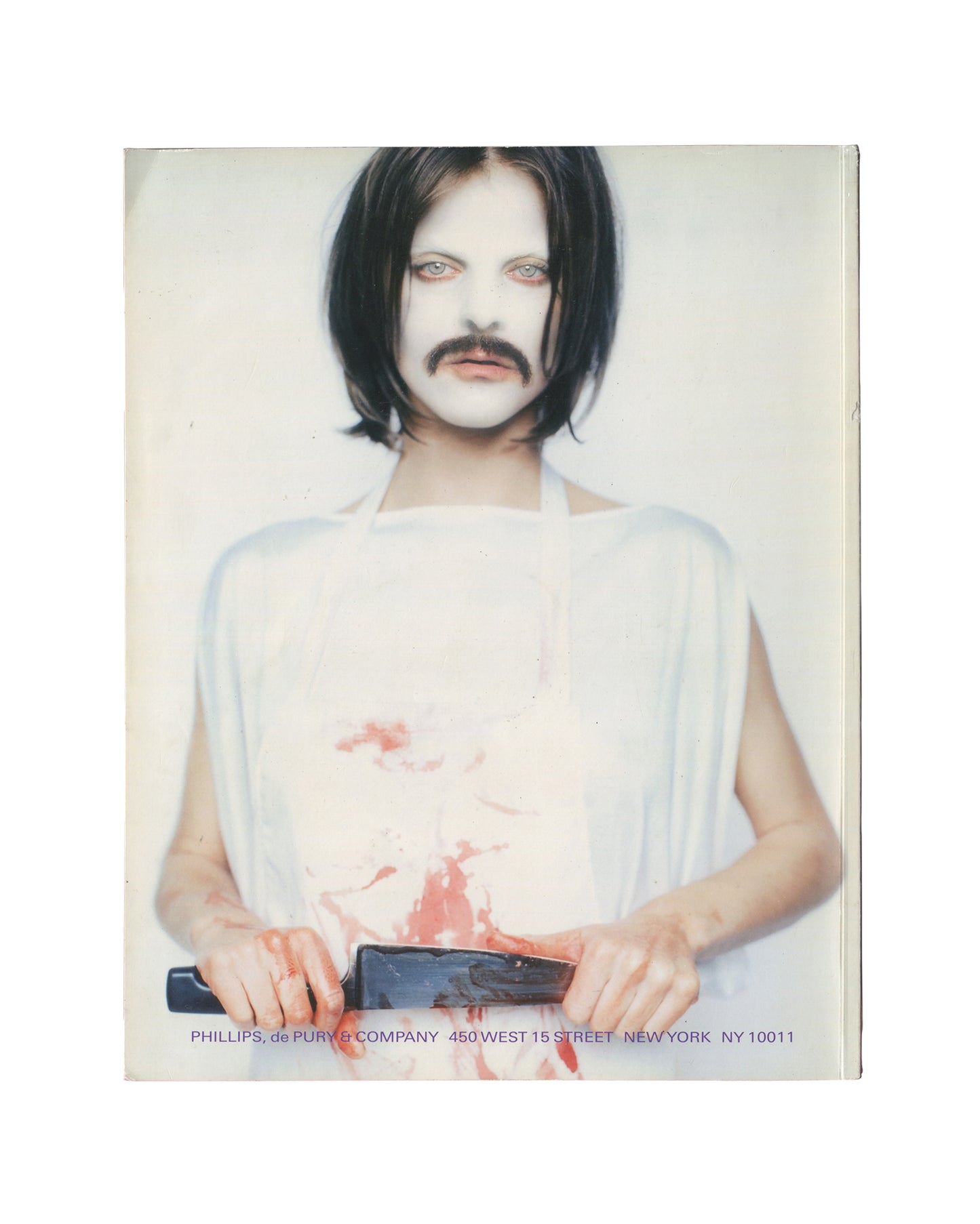 THE NEW RARE EDITIONS — Record: June 6, 2005. 2005 / 2008 / 2026. Auction catalogue back cover, Phillips de Pury & Company, Contemporary Art: Including Prints, Photographs & Multiples, New York, 6 June 2005; 76 pp. Full-bleed colour photograph — figure in white draped garment, white face paint, dark bob wig and painted moustache, holding a dark object at waist height; red paint or simulated blood across torso and hands; direct frontal gaze; white ground. Lower edge: black sans-serif — 'PHILLIPS, de PURY & C