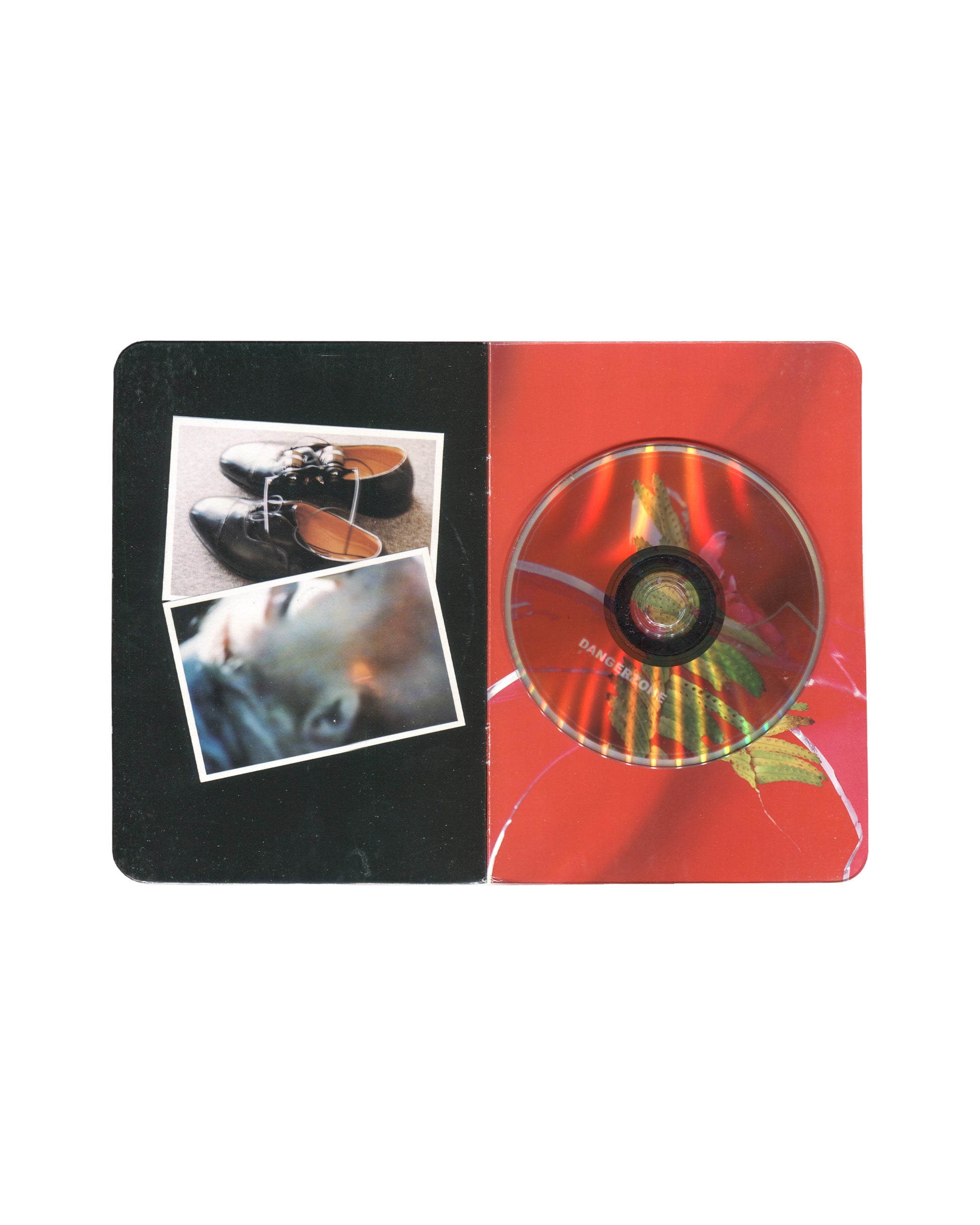 Anne & Patrick Poirier, Dangerzone, 2004, interior: three Polaroids on black left; ANNE ET PATRICK POIRIER in red right