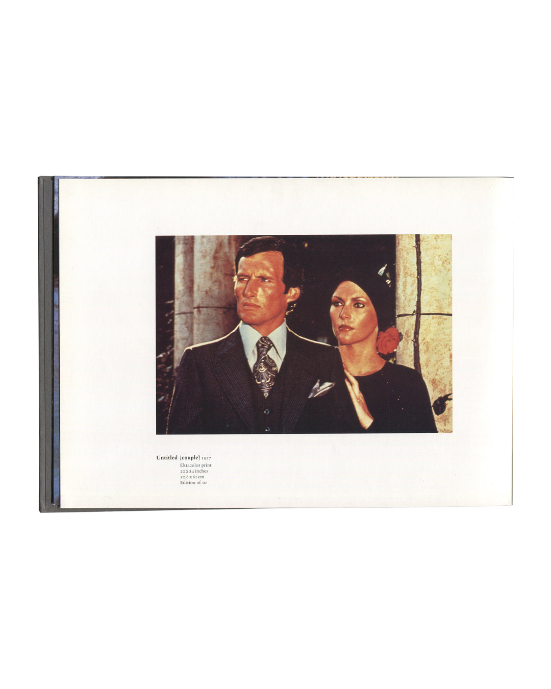Richard Prince, Early Photographs 1977–1979, interior page. Untitled (couple), 1977. Ektacolor print, 20 × 24 inches, 50.8 × 61 cm, edition of 10. Colour photograph of a man and woman in formal dress, rephotographed from a film still or television source. The man wears a dark suit and tie; the woman wears a black dress with a red flower. Both face slightly left, expressions neutral. Skarstedt Fine Art, New York, 2001.