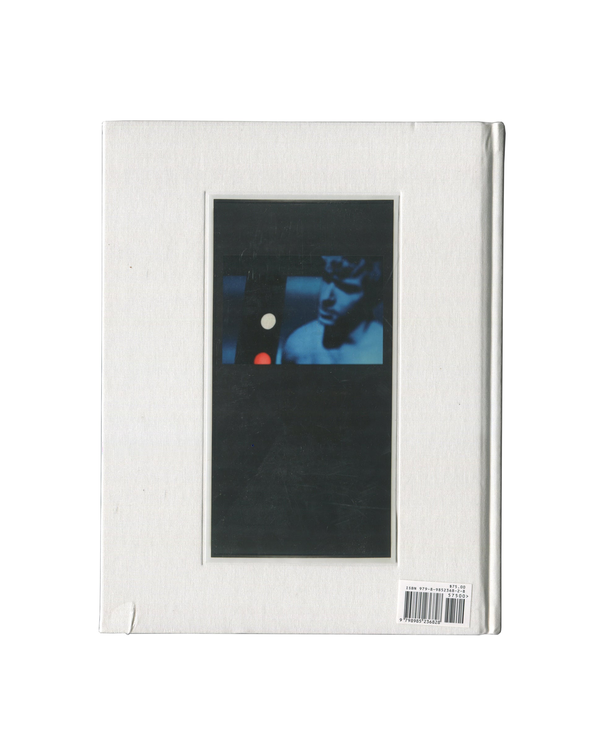 The back cover of The Entertainers Richard Prince art book featuring a textured off-white cover with a central vertical black panel containing a blue-toned portrait photograph, and a barcode sticker in the bottom right corner.
