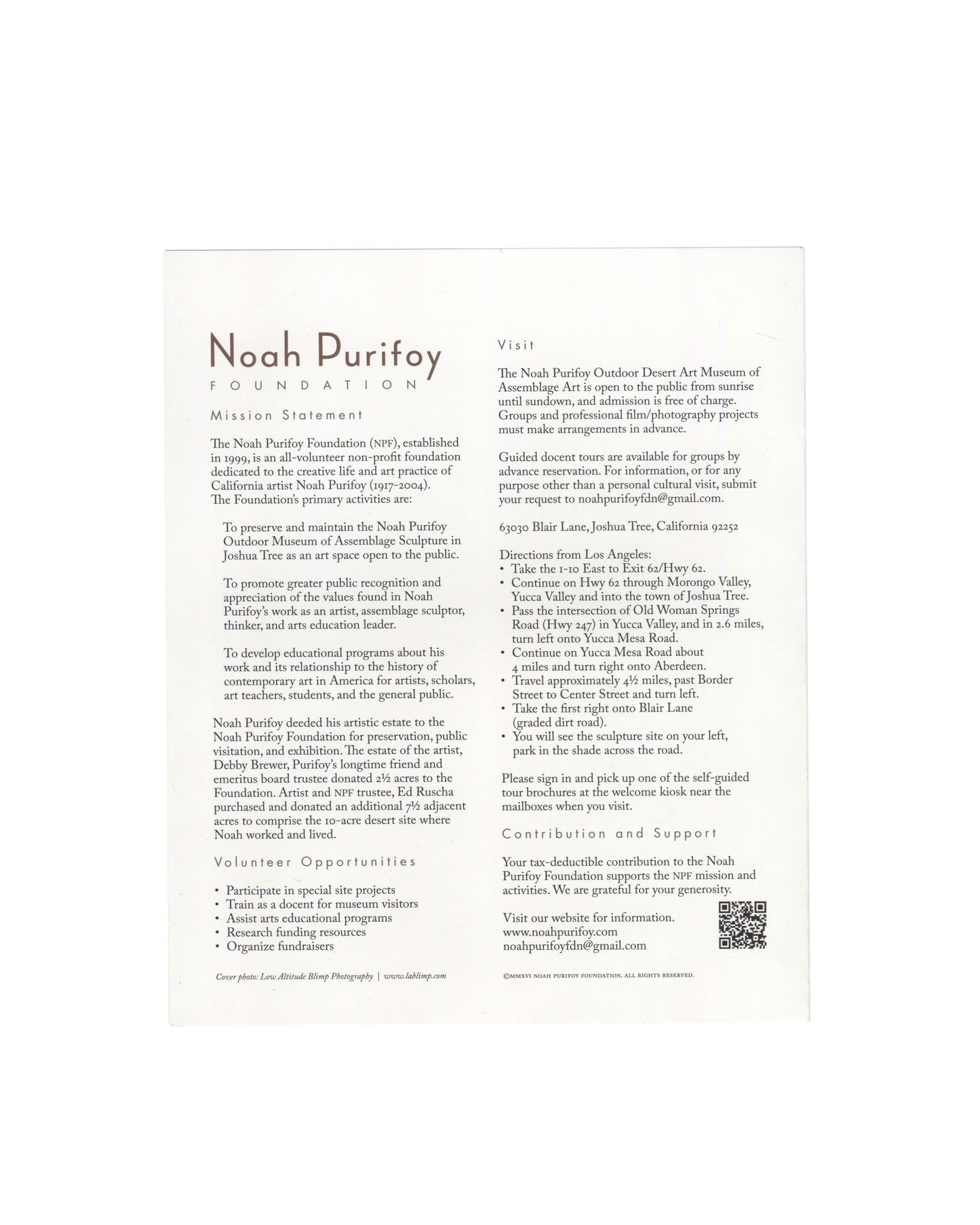 Noah Purifoy Foundation museum brochure, Joshua Tree, c. 2022, reverse panel, white ground with Noah Purifoy / FOUNDATION in brown serif and spaced caps at upper left; mission statement and foundation history in two columns; Volunteer Opportunities bullet list; at right Visit panel with opening hours, free admission, address, directions from Los Angeles, Contribution and Support section with QR code, and website www.noahpurifoy.com.
