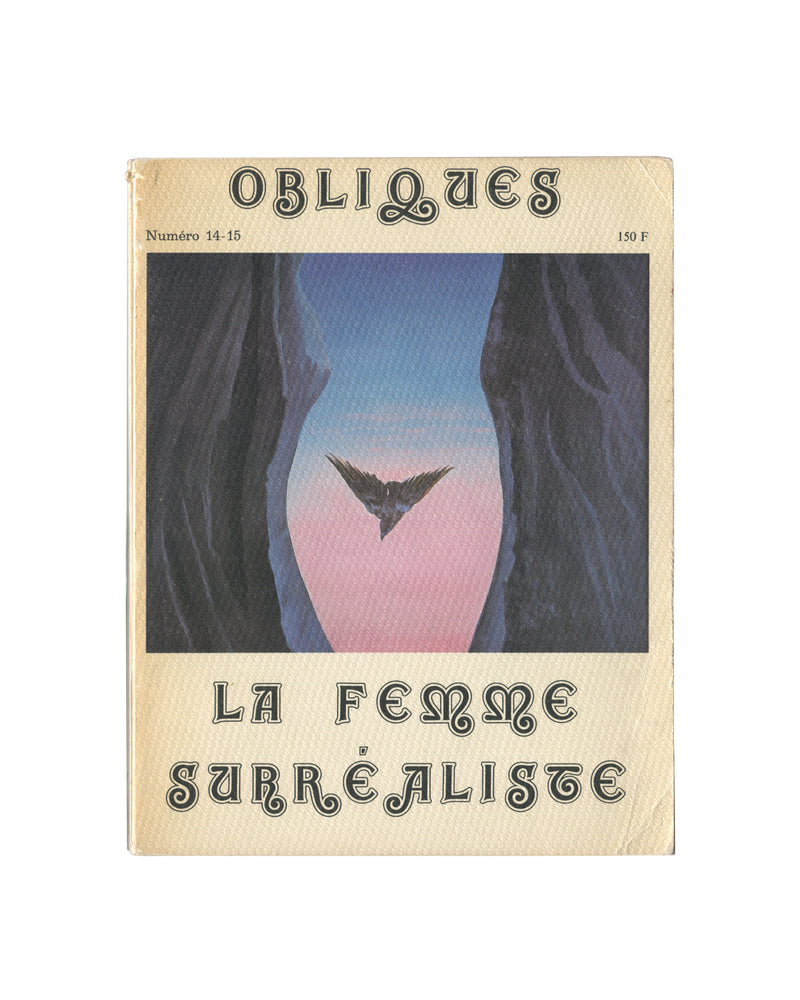 Obliques No. 14–15, La Femme Surréaliste — front cover. Éditions Borderie, Paris, 1977. Decorative gothic lettering on cream textured card. Centre image: Jane Graverol's L'Esprit saint, a bird in flight suspended within a rock formation reading as a torso. Surrealist exhibition ephemera.