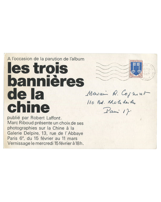 Original 1967 Galerie Delpire exhibition announcement card for Marc Riboud, Les trois bannières de la Chine, Paris, verso, white card with bold black sans-serif typography: A l'occasion de la parution de l'album in small type at top; les trois / bannières / de la / Chine in very large bold lower-case type at left; publisher and exhibition details below; at upper right a blue French postage stamp (0.25 F, Mont-de-Marsan heraldic arms) with wavy-line postal cancellation; handwritten address in ink at centre 