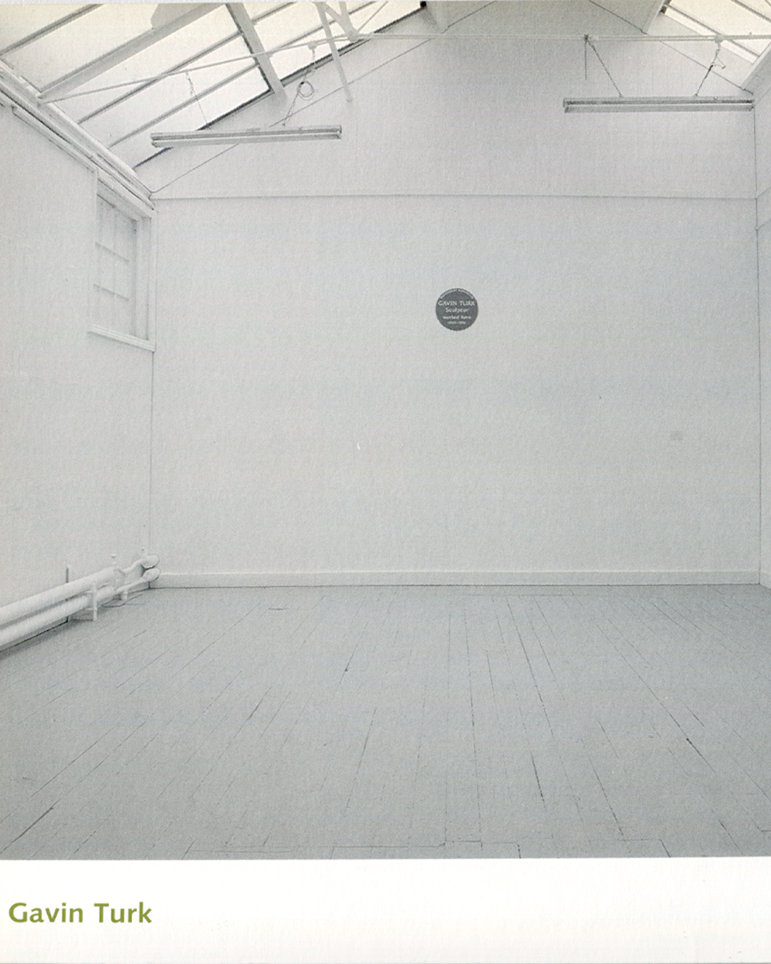 Gavin Turk, Cave, 1991, empty white studio with blue plaque, frieze Issue 1
