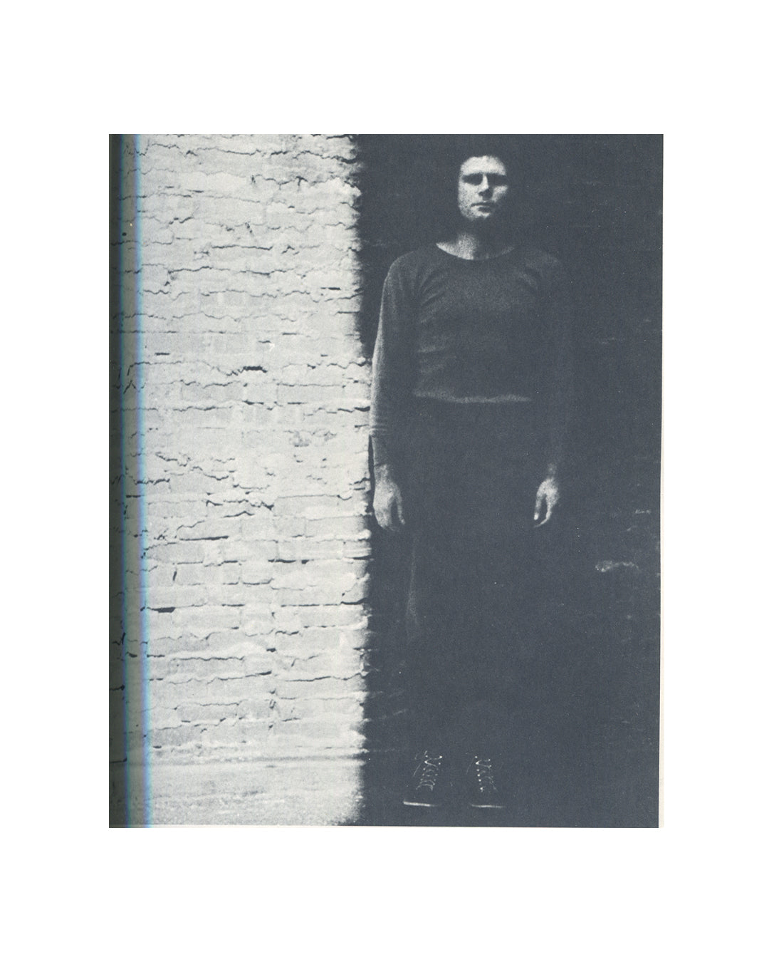 Klaus Rinke, Zeit Raum Körper Handlungen, 1972, interior, b&w photograph, figure standing against whitewashed brick wall in shadow 