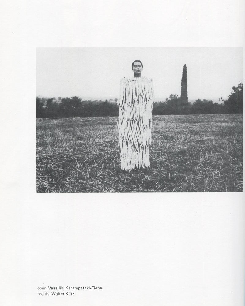 Klaus Rinke, Saldo, Rinke Klasse 1997, Vassiliki Karampataki-Fiene, figure in shredded white costume standing in harvested field, b&w
