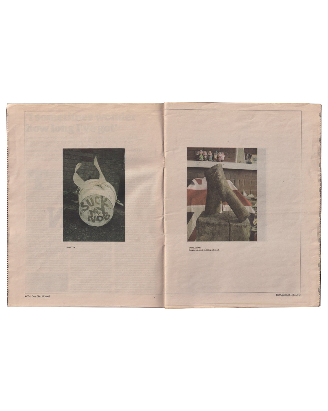 Sarah Lucas, GOD IS DAD, The Guardian G2, 17 October 2005. Interior spread, pages 6–7: two black-and-white photographs of Lucas sculptures on newsprint — left: ceramic piece inscribed 'SUCK MY NOB'; right: phallic ceramic sculpture on plinth with small figurines on shelf behind

