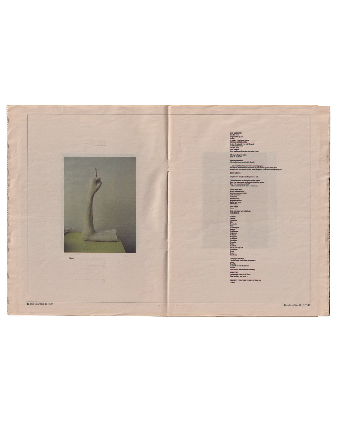 Sarah Lucas, GOD IS DAD, The Guardian G2, 17 October 2005. Interior spread, pages 12–13: left page with colour photograph of Liner, a pale arm rising from a mattress holding a cigarette upright; right page with dense text columns listing works and exhibition details