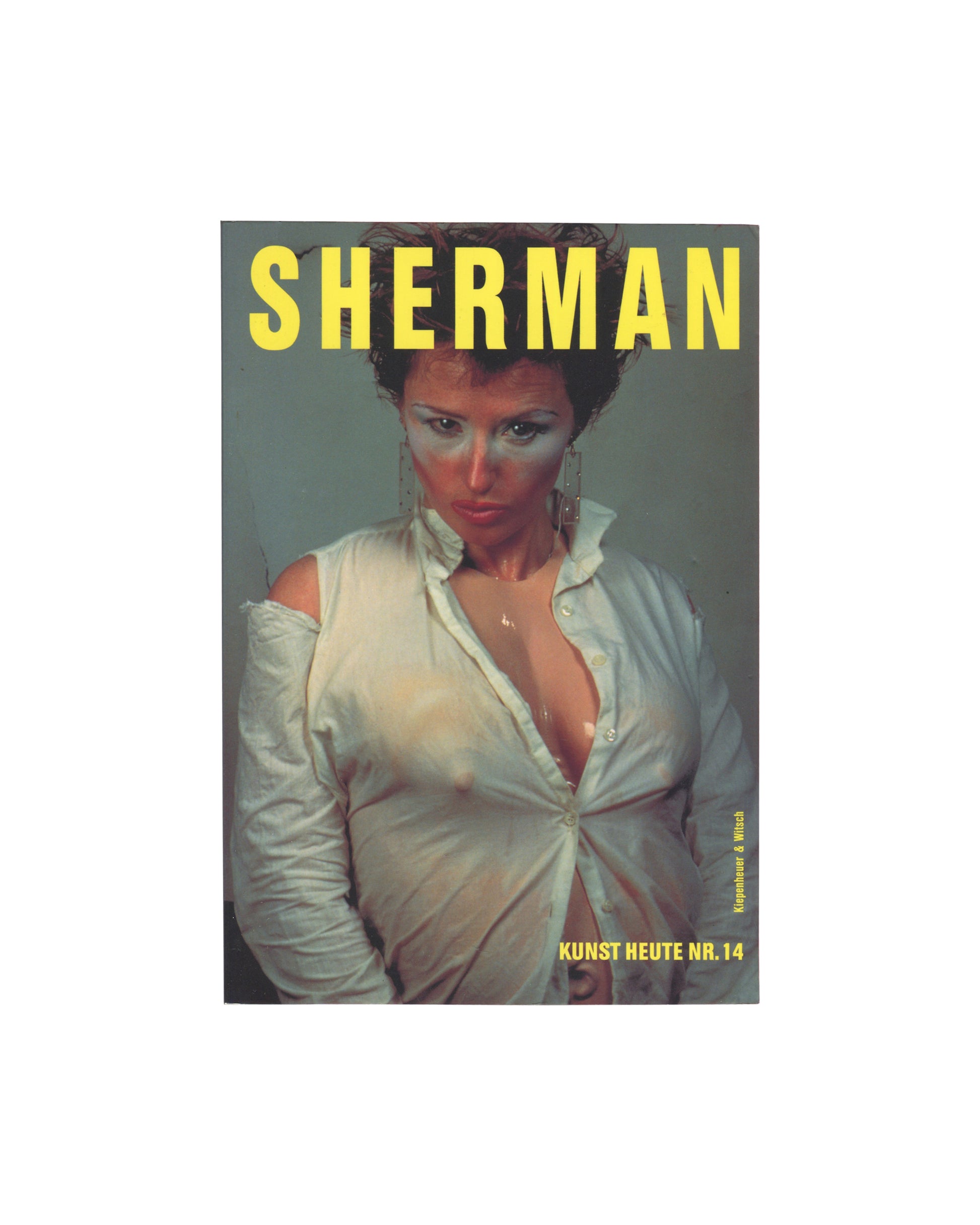 Cindy Sherman, Kunst heute Nr. 14, Kiepenheuer & Witsch 1995, front cover: grey, yellow spaced title, colour photo of Sherman in open white shirt, heavy eye make-up
I