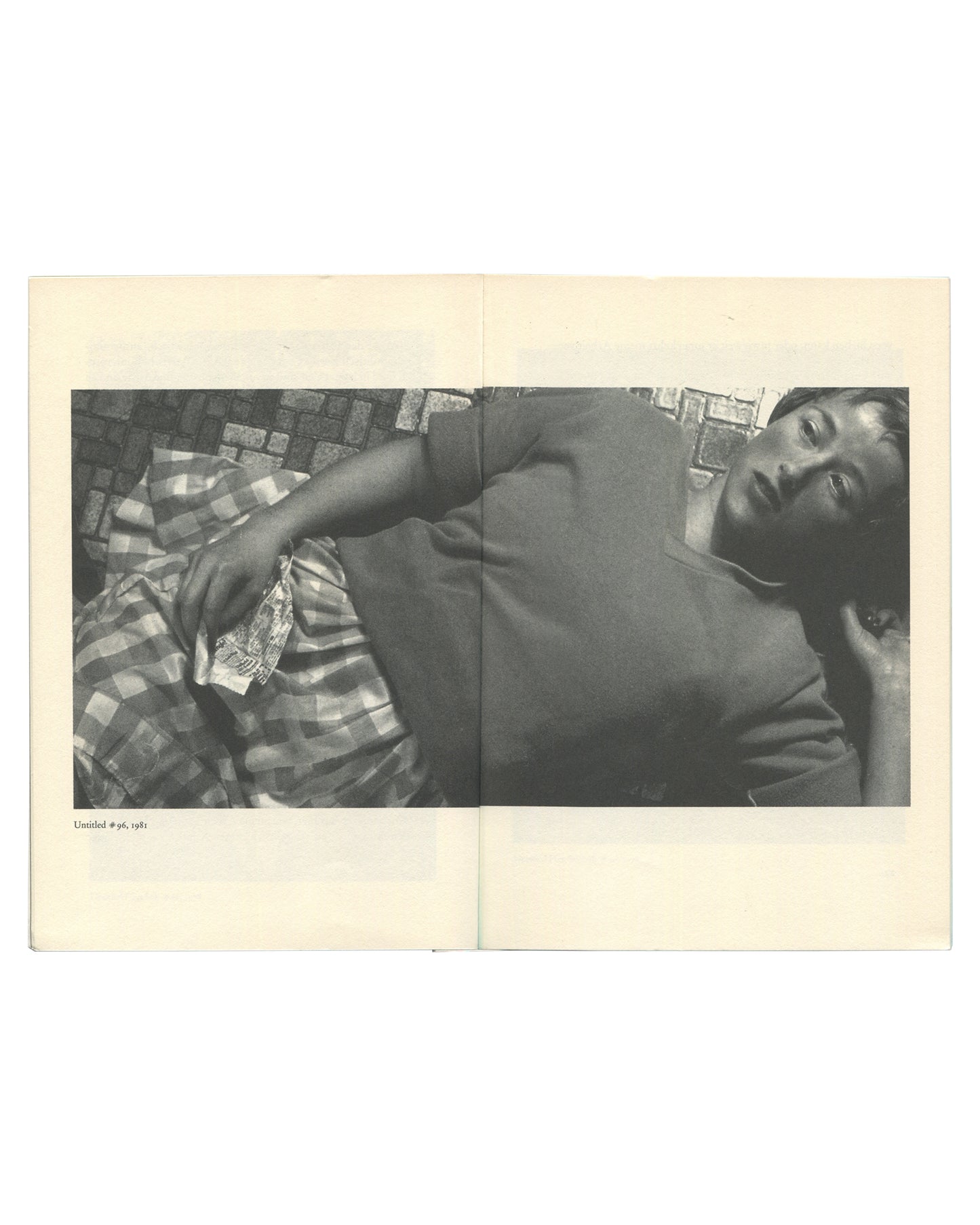 Cindy Sherman, Kunst heute Nr. 14, 1995, interior spread: b&w Untitled #96, 1981 — figure reclining on tiled floor, checked fabric, caption lower left
