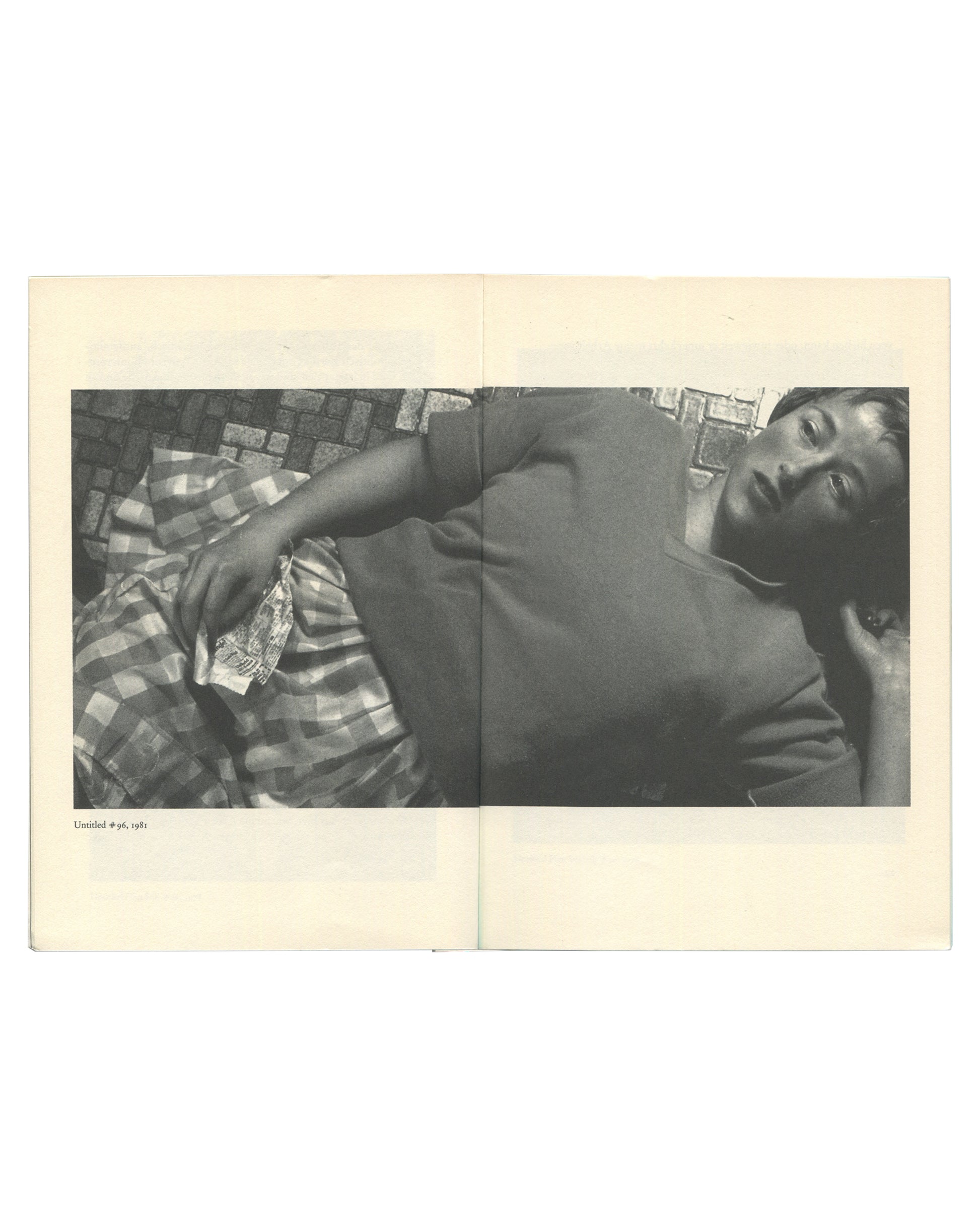 Cindy Sherman, Kunst heute Nr. 14, 1995, interior spread: b&w Untitled #96, 1981 — figure reclining on tiled floor, checked fabric, caption lower left
